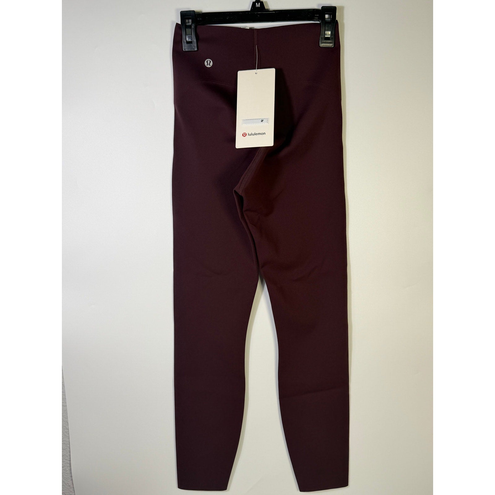 Lululemon Glow Up SHR Tight 25-inch women's leggings in size 4, featuring a sleek, form-fitting design and high-rise waist.