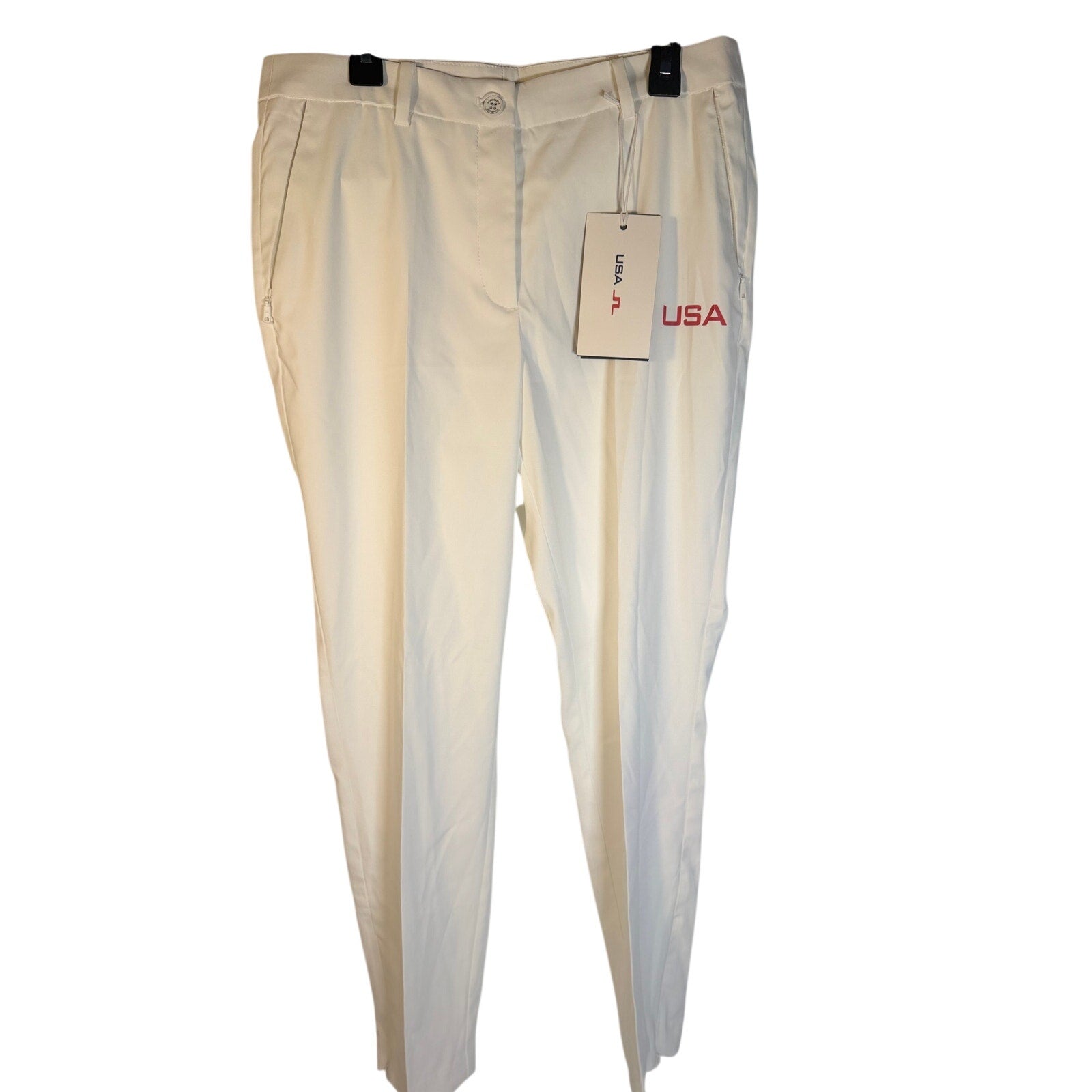 Men's white J.Lindeberg golf pants, size 28, new with tags, featuring a tailored fit and classic golf apparel design.