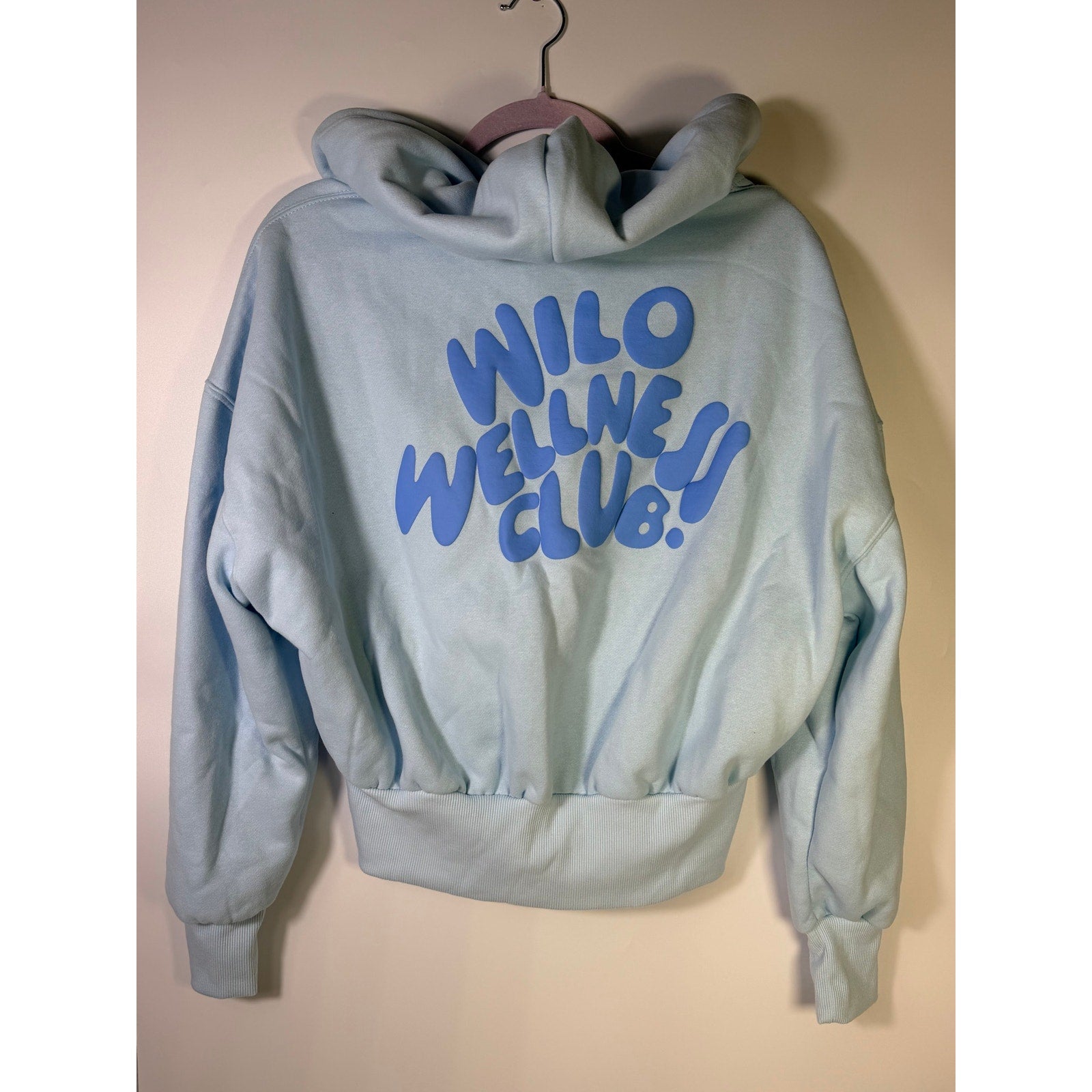 Blue Wilo The Label wellness club crop zip hoodie for women, size M, shown on a model with a casual fit and sporty style.