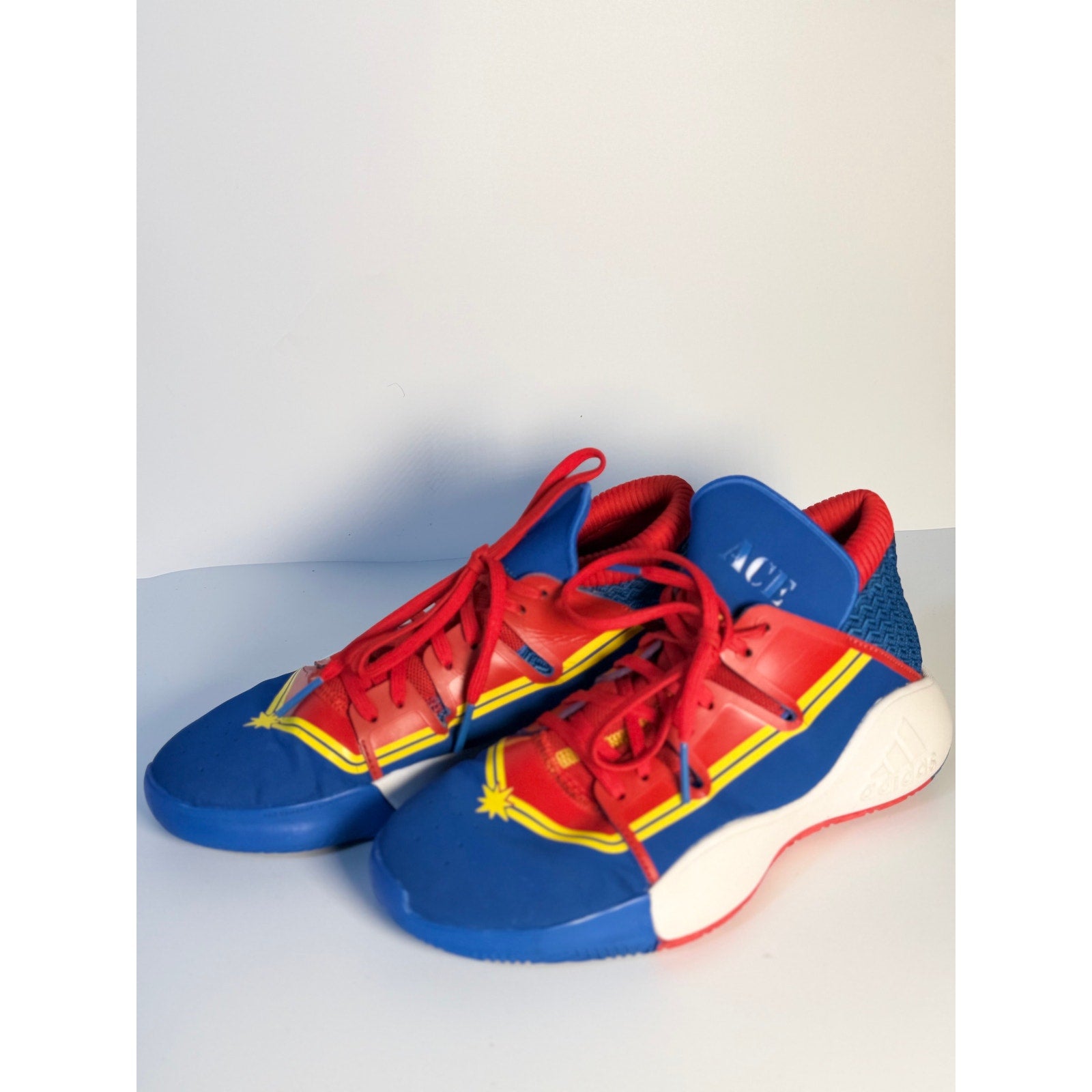 Adidas Exhibit A Captain Marvel basketball shoes in blue and red for men, US size 7, featuring sporty design and logo details.