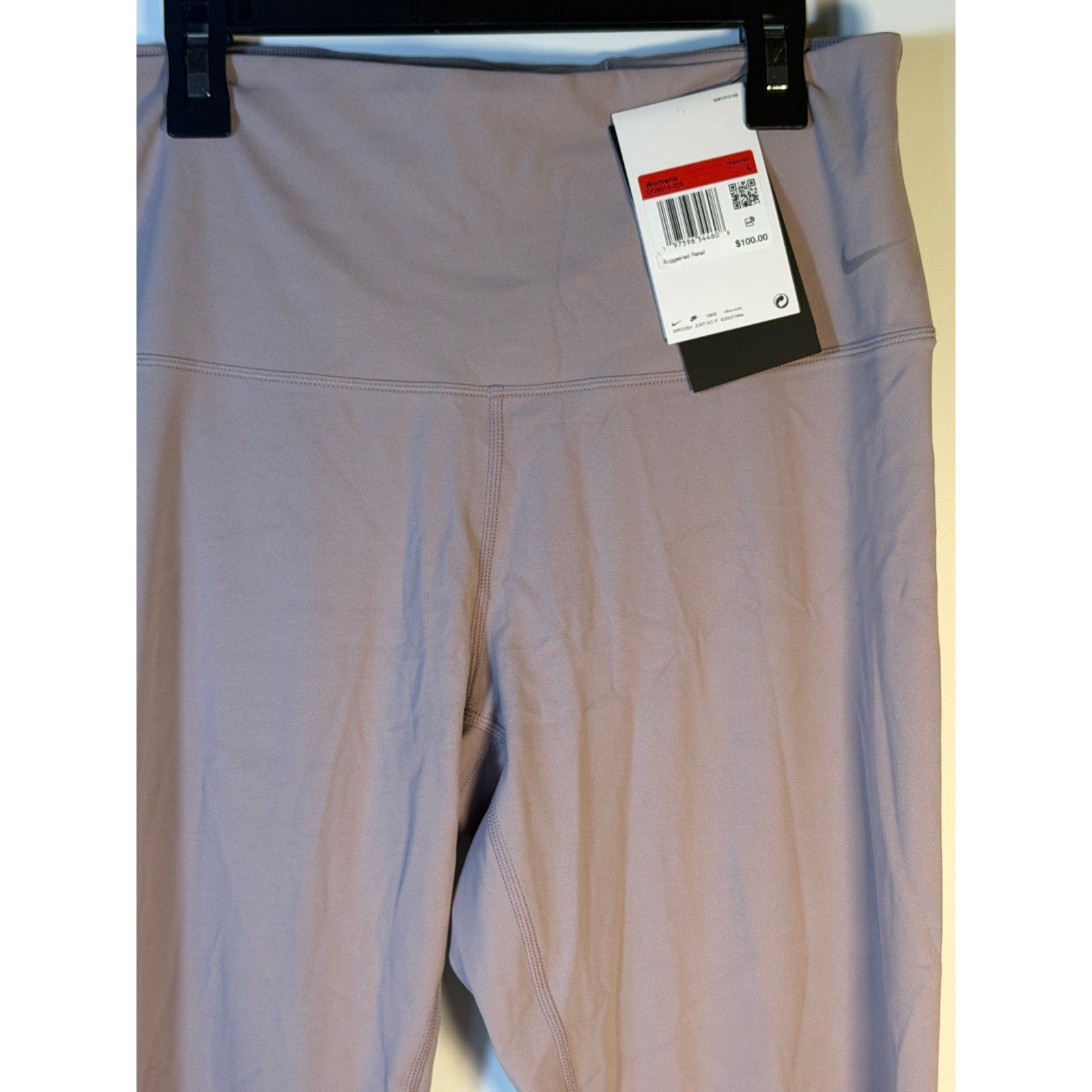 Nike women's high-rise full-length taupe leggings, large size, suitable for training, with a sleek, fitted design.