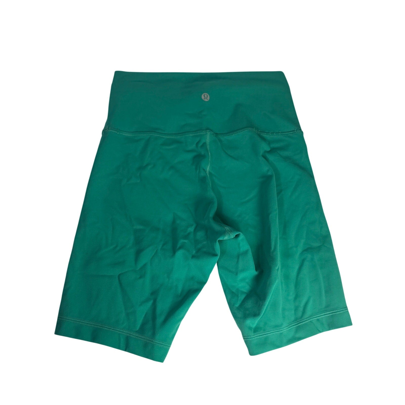 Lululemon women’s high-rise teal green biker shorts, size 6, shown laid flat with smooth fabric and elastic waistband.