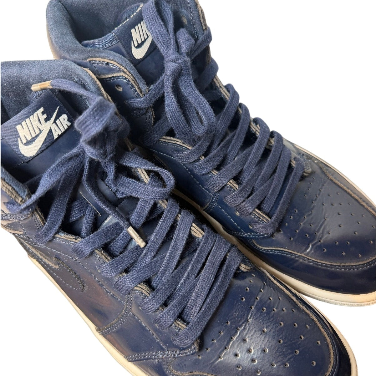 Men's Air Jordan 1 Retro High OG sneakers by Nike in Obsidian and White, featuring a classic high-top design.
