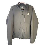 Black The North Face men's softshell jacket with full zip and fleece lining, featuring a high collar and durable fabric.