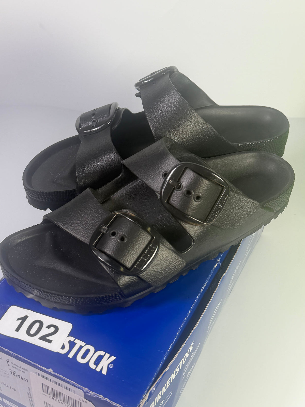 Black Birkenstock Arizona EVA sandals with large buckle, designed for women, size US 7 / EU 38 narrow fit.