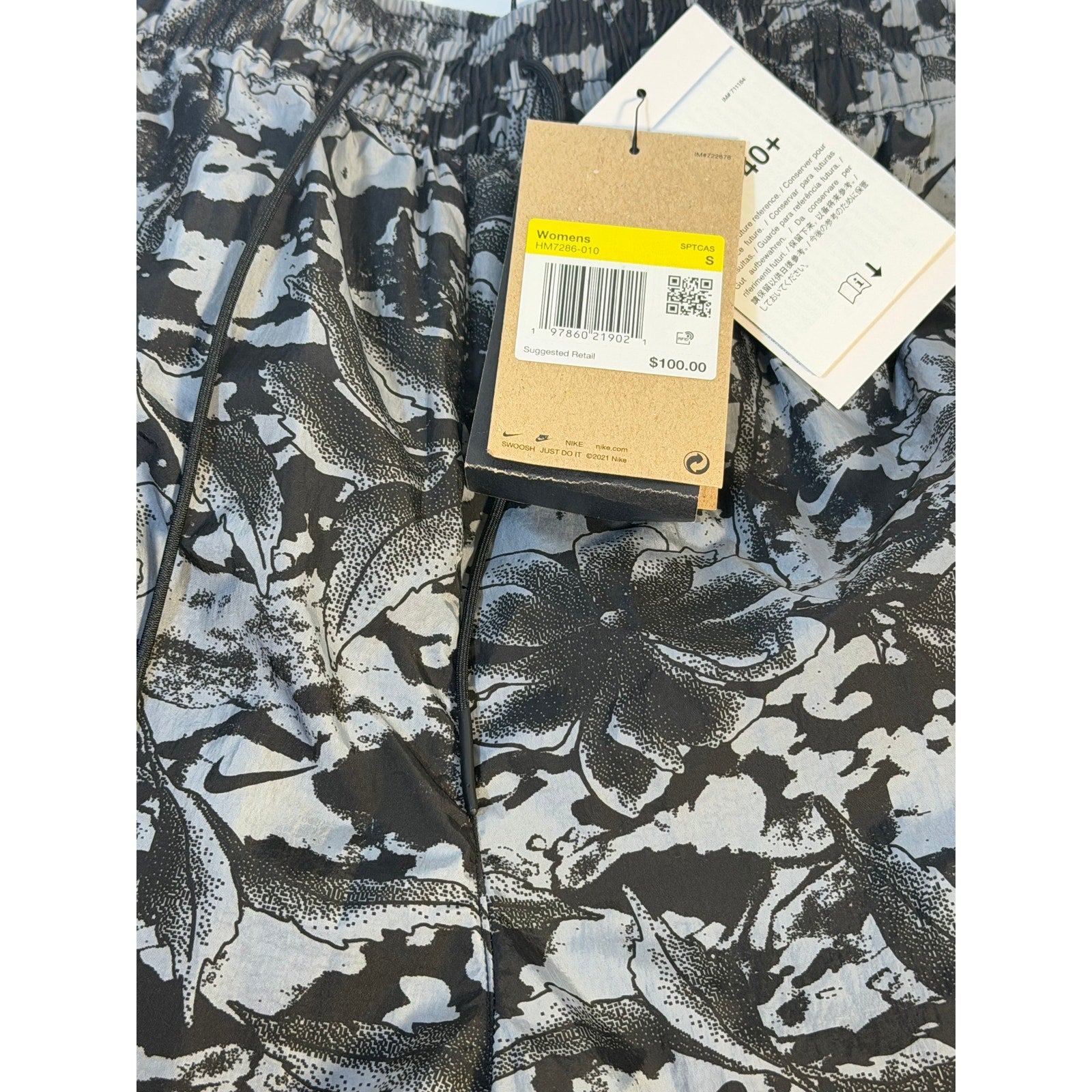 Nike Dri-FIT ADV women's running shorts in black with gray floral print, size small, lightweight athletic shorts for running.