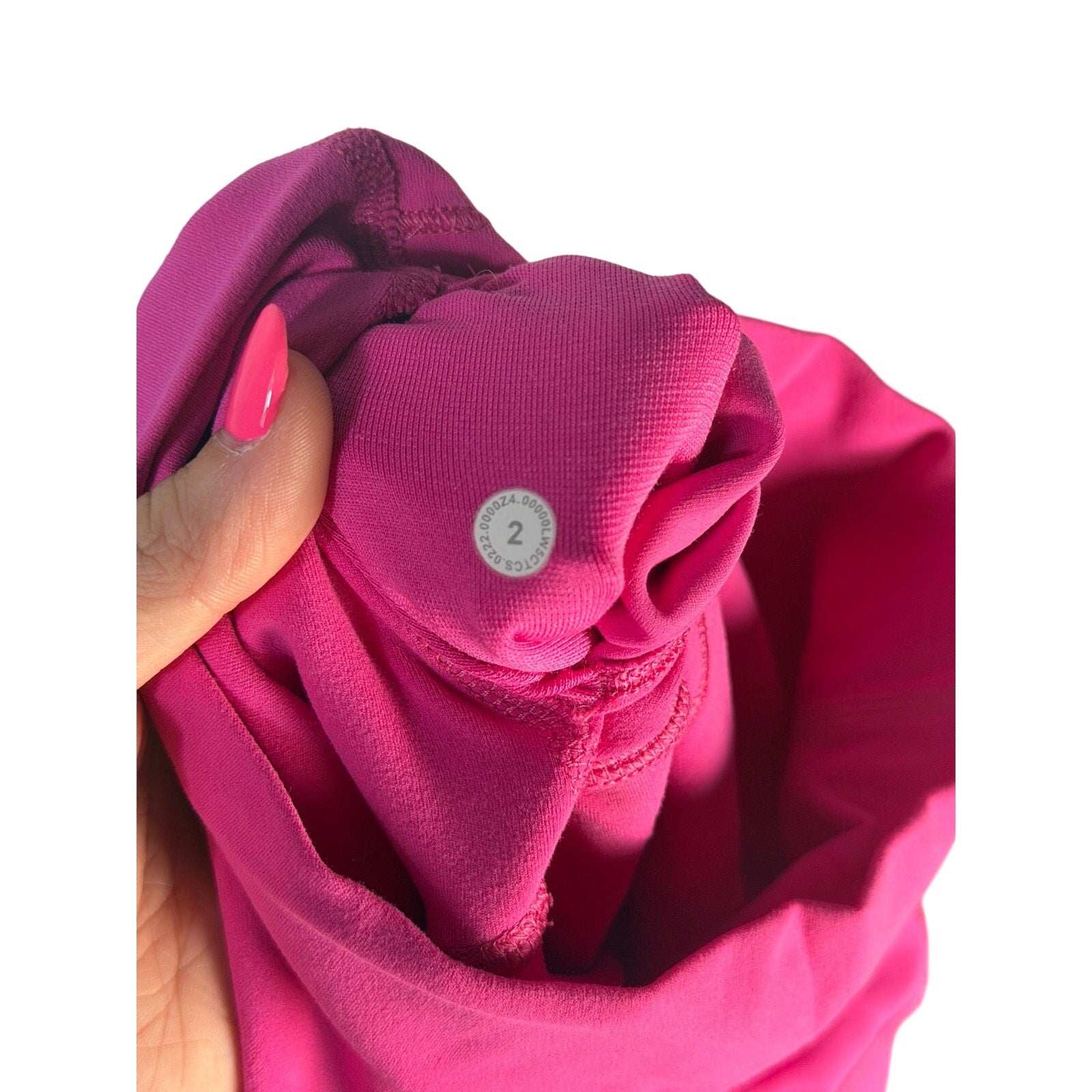 Pink Lululemon Wunder Under high rise leggings for women, size 2, athletic pants with a snug fit and comfortable waistband.