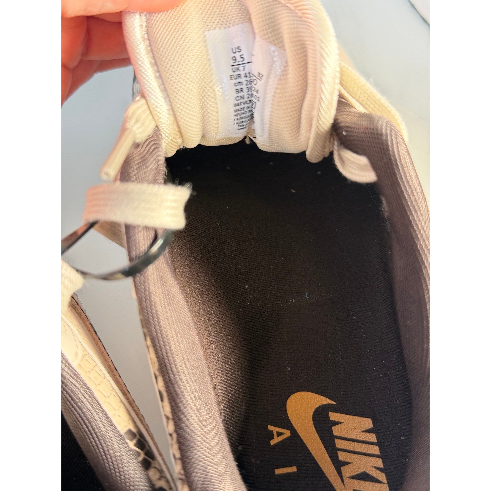 Nike Air Max 1 Premium Snakeskin sneakers in white and gray, featuring textured snakeskin pattern, women's US 9.5 size.