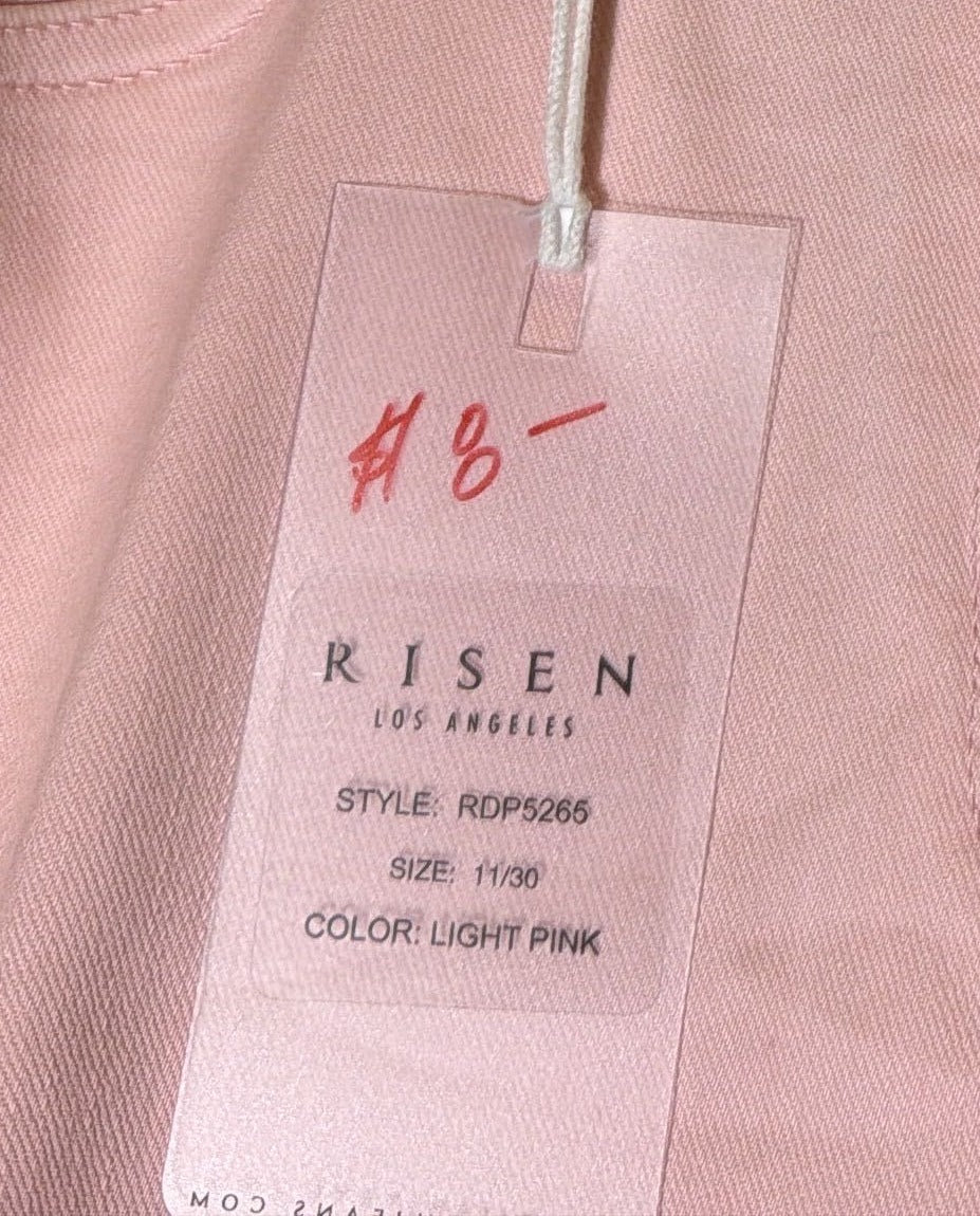 Risen women's high rise cropped flare jeans in light pink with distressed fray hem, size 11, new with tags.