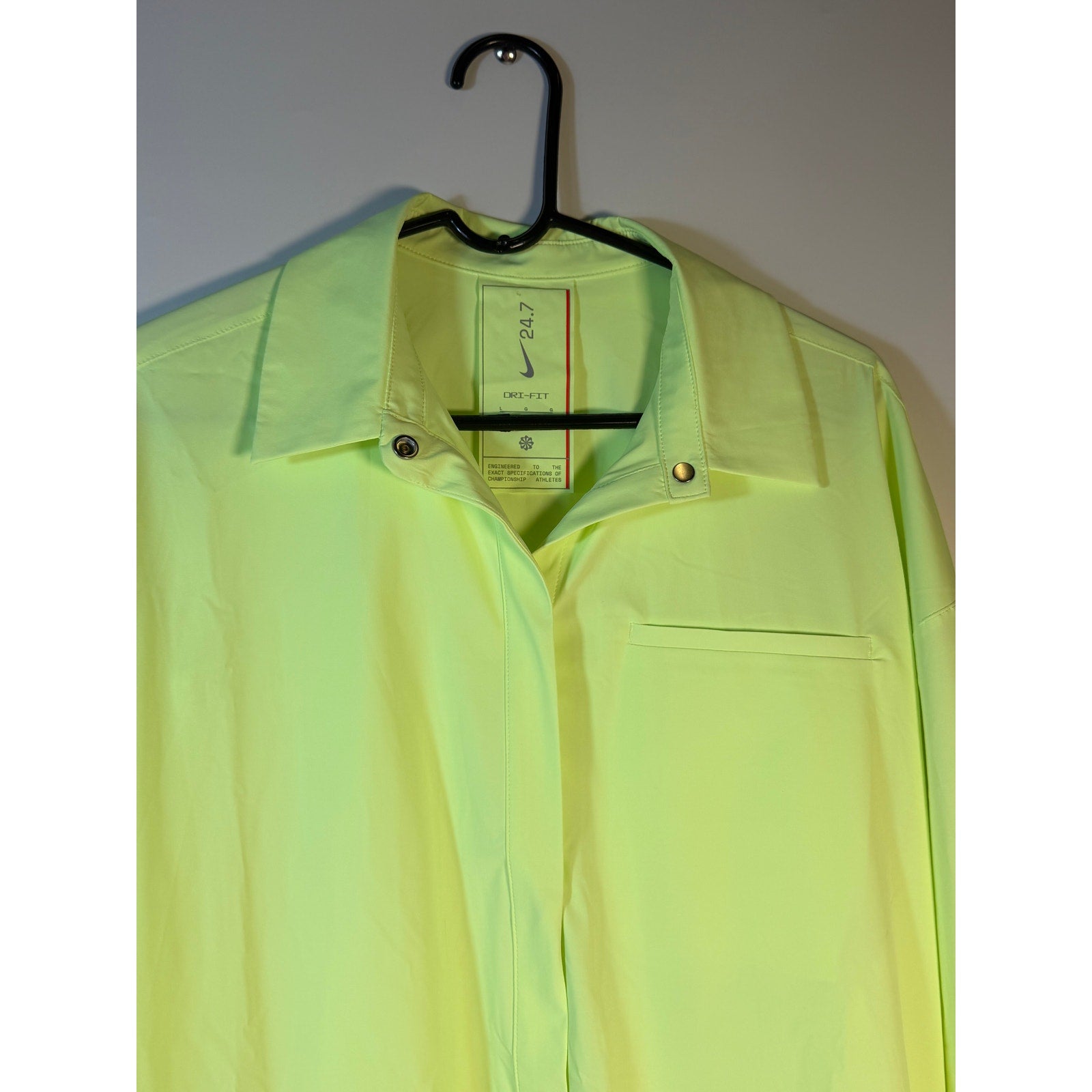 Nike 24.7 Dri-FIT women's training dress in volt green, large size, lightweight athletic dress with short sleeves and Nike branding.