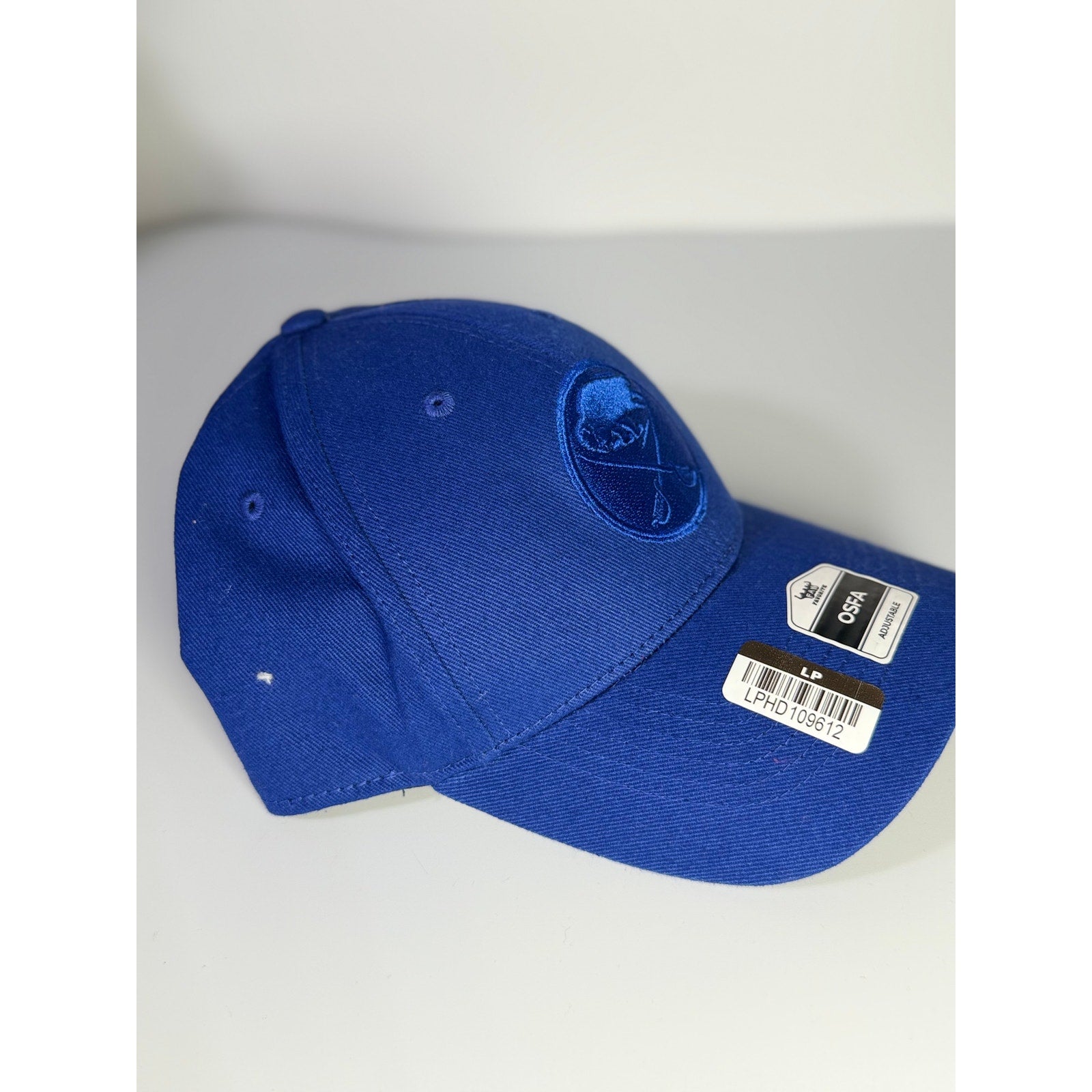 Fan Favorite Buffalo Sabres NHL tonal blue adjustable baseball cap with tags, featuring team logo and adjustable strap.
