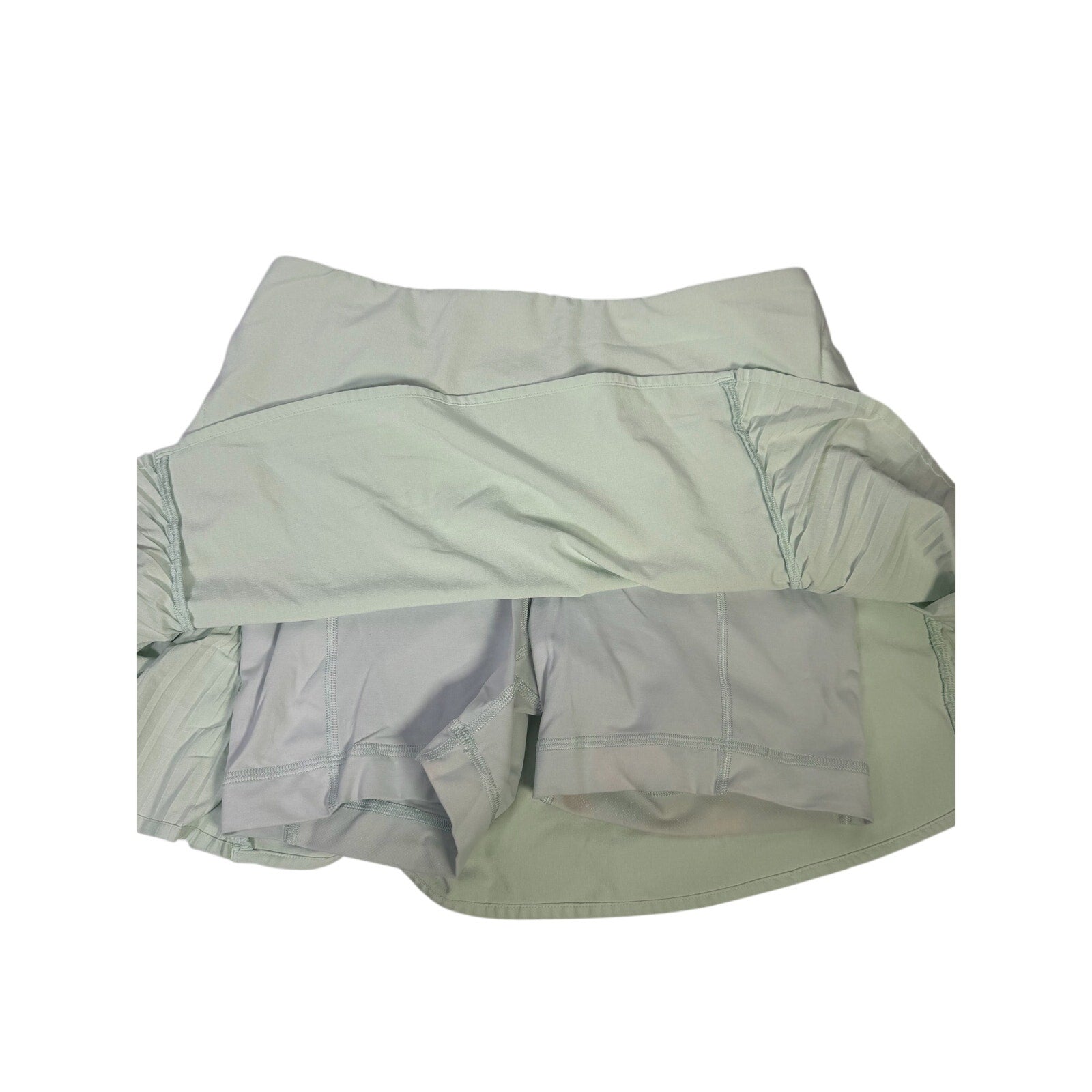 Lululemon women's light mint pleated tennis skort with built-in shorts, size 6, featuring a comfortable athletic design.
