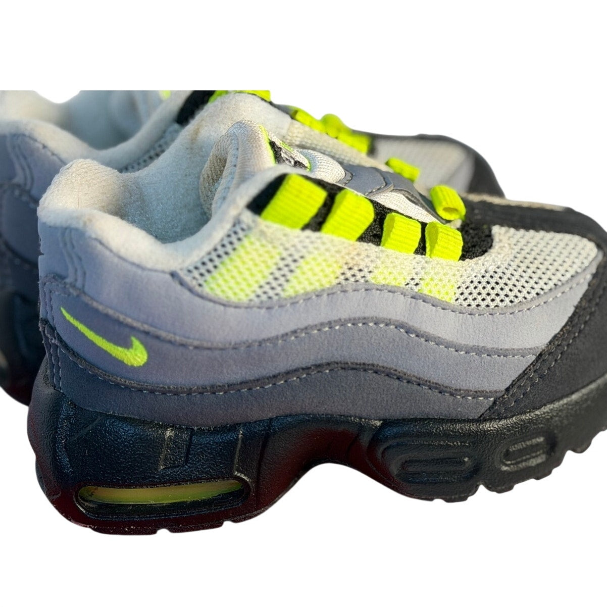 Nike Air Max 95 toddler sneakers in gray, volt, and black with breathable mesh and sporty design for kids.