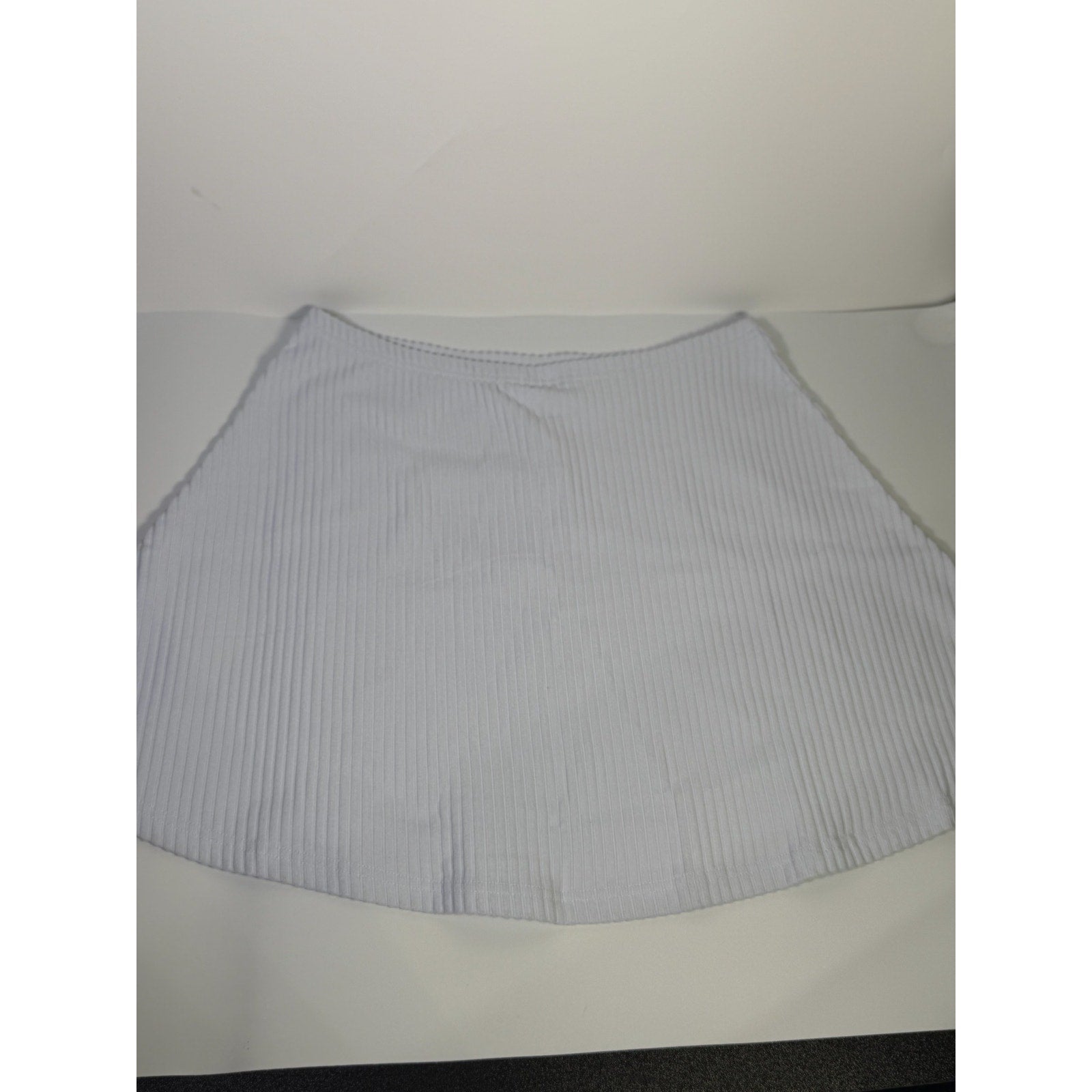 Nike women's ribbed mini skirt in sapphire mist color, size M, displaying a fitted style with ribbed texture.