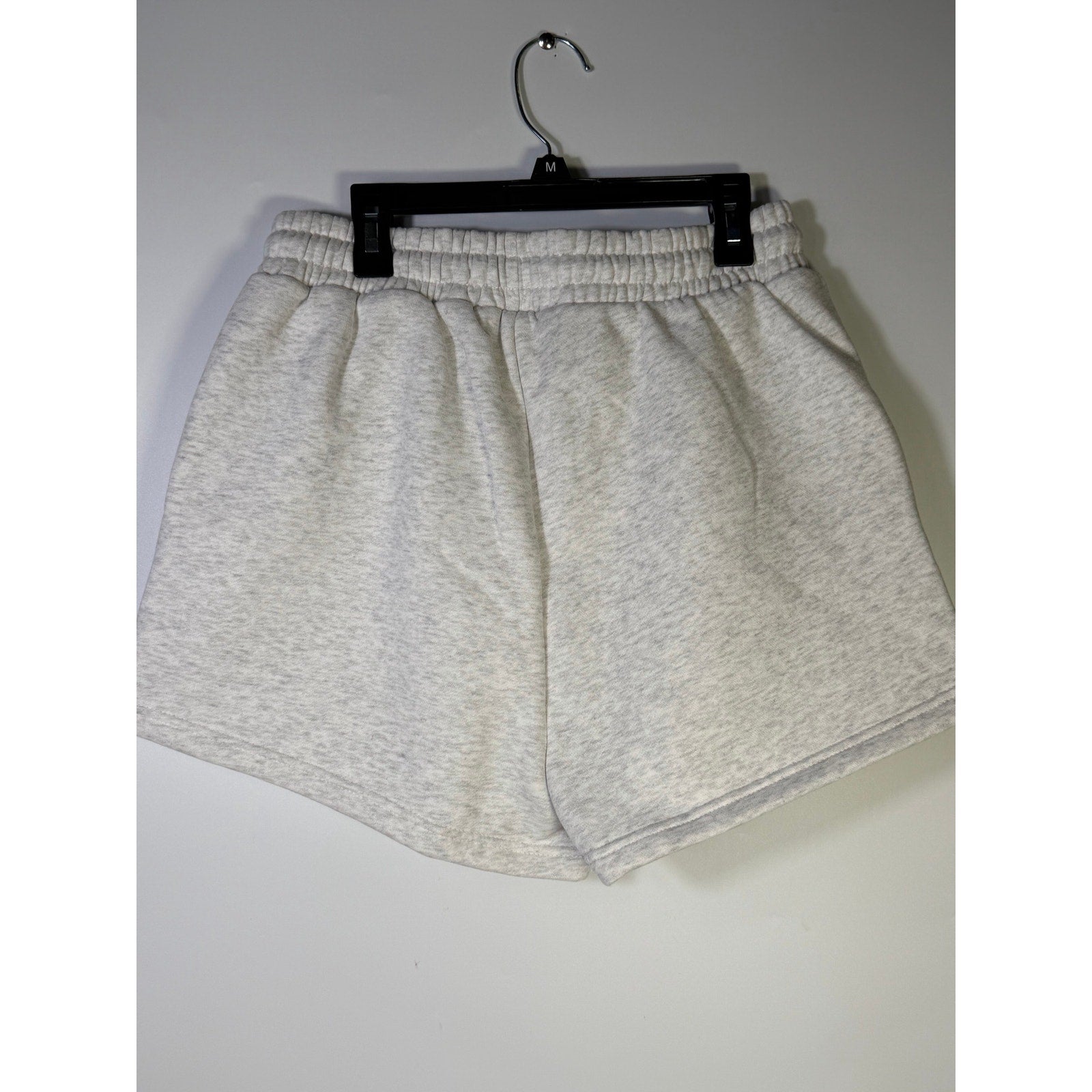 White marle fleece jog shorts for women by WILO, size M, showing the relaxed fit and soft fabric detail.