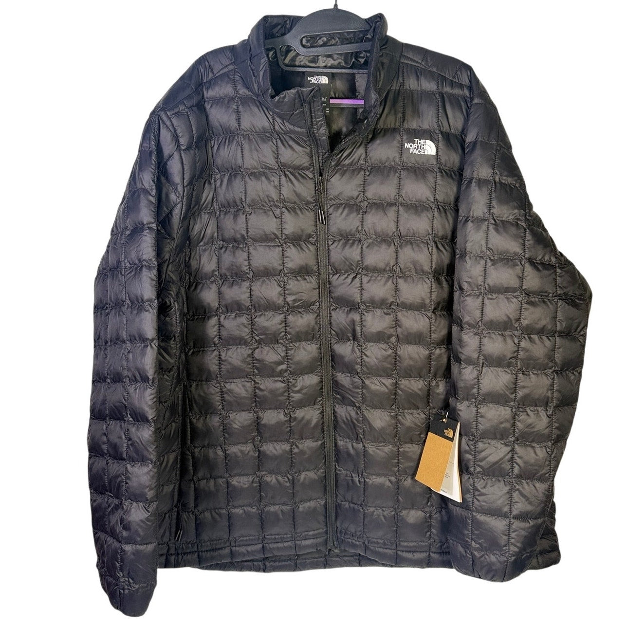 The North Face Women’s Plus ThermoBall Eco Jacket in black, size 3X Tall, showcasing the insulated, lightweight design and front zipper.