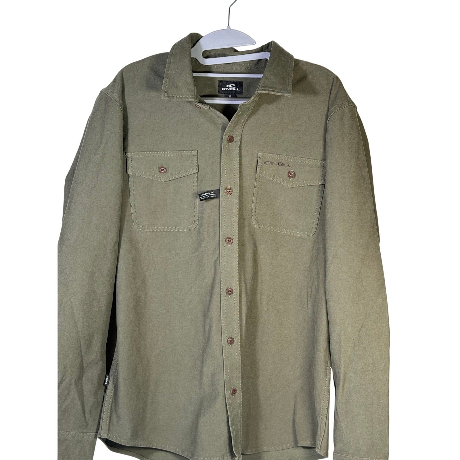 O'Neill men's olive green utility overshirt, size medium, displayed flat showing front design and button details.