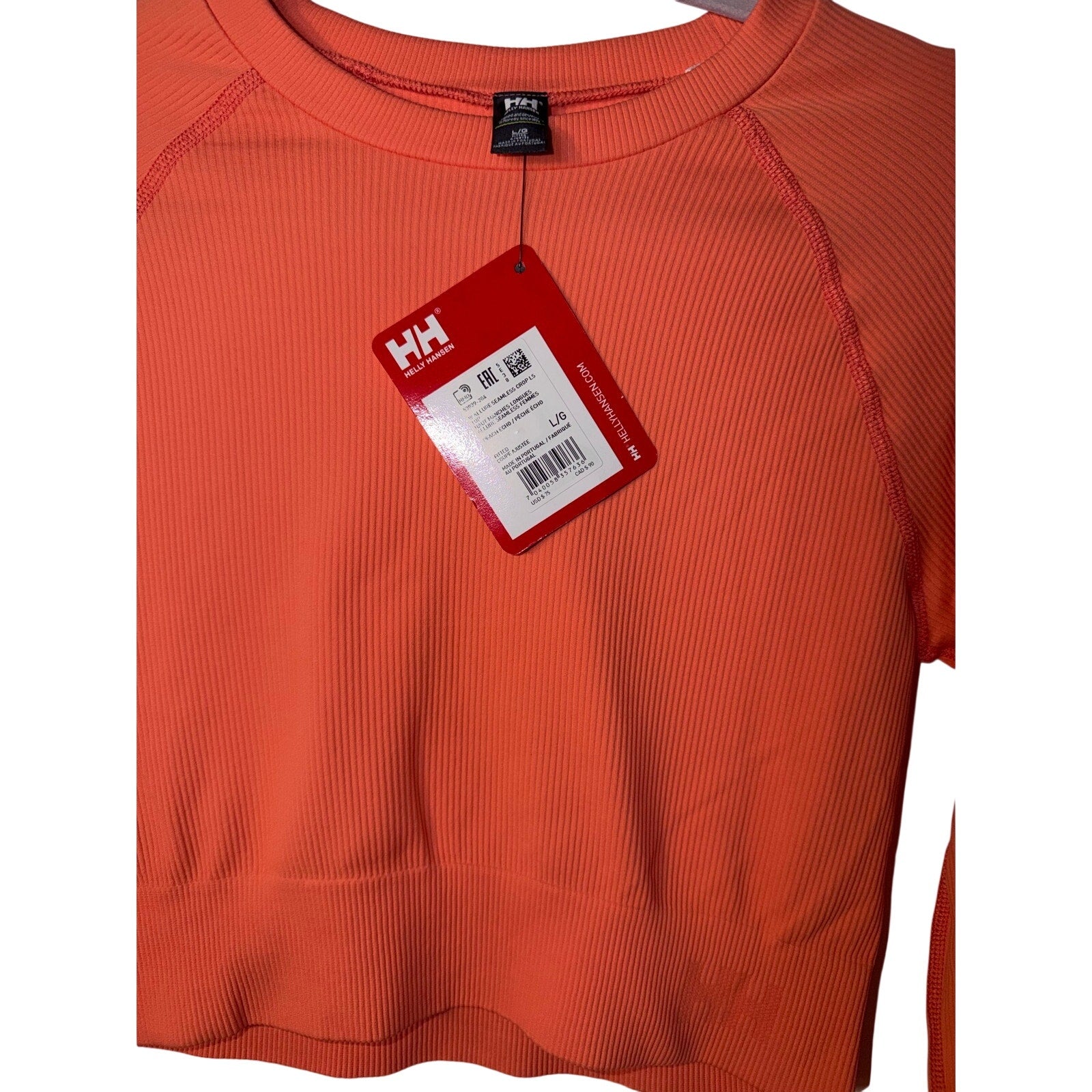 Youth Helly Hansen long sleeve T-shirt in peach, size large, casual fit, soft fabric, front view.
