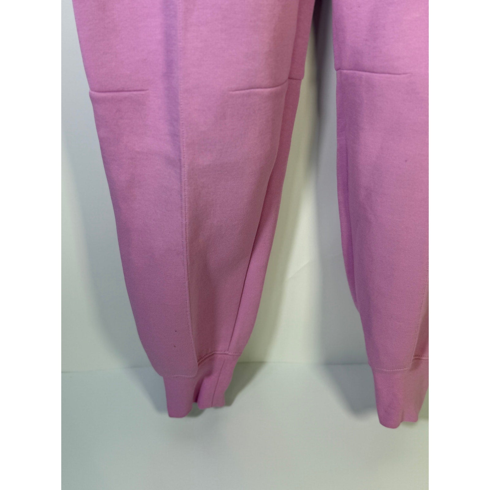 Nike Sportswear Phoenix fleece jogger sweatpants for women, pink mid-rise fit, size XS, soft fleece fabric, front and back view