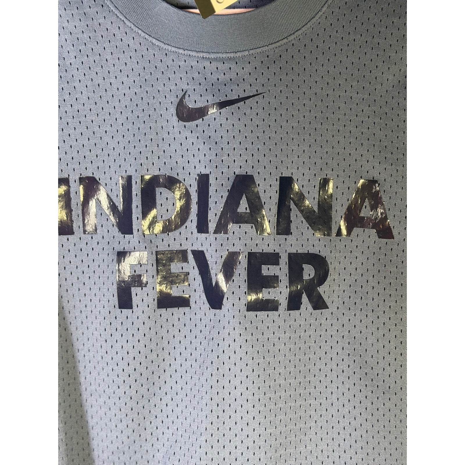 Blue Nike WNBA Indiana Fever women's mesh basketball tank top, size L, featuring team logo and breathable fabric.