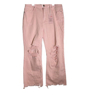 Risen women's high rise cropped flare jeans in light pink with distressed fray hem, size 11, showing front view with faded details.