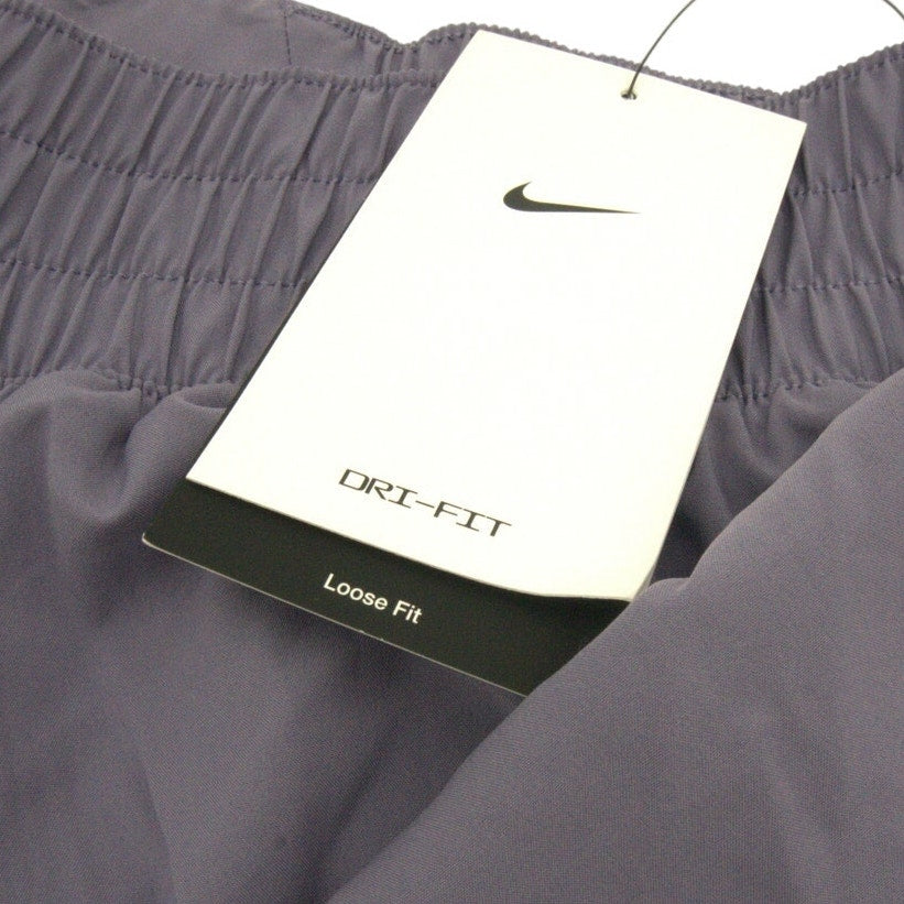 Nike Women's Dri-FIT running shorts in gray with tags, lightweight athletic shorts for women, front view.