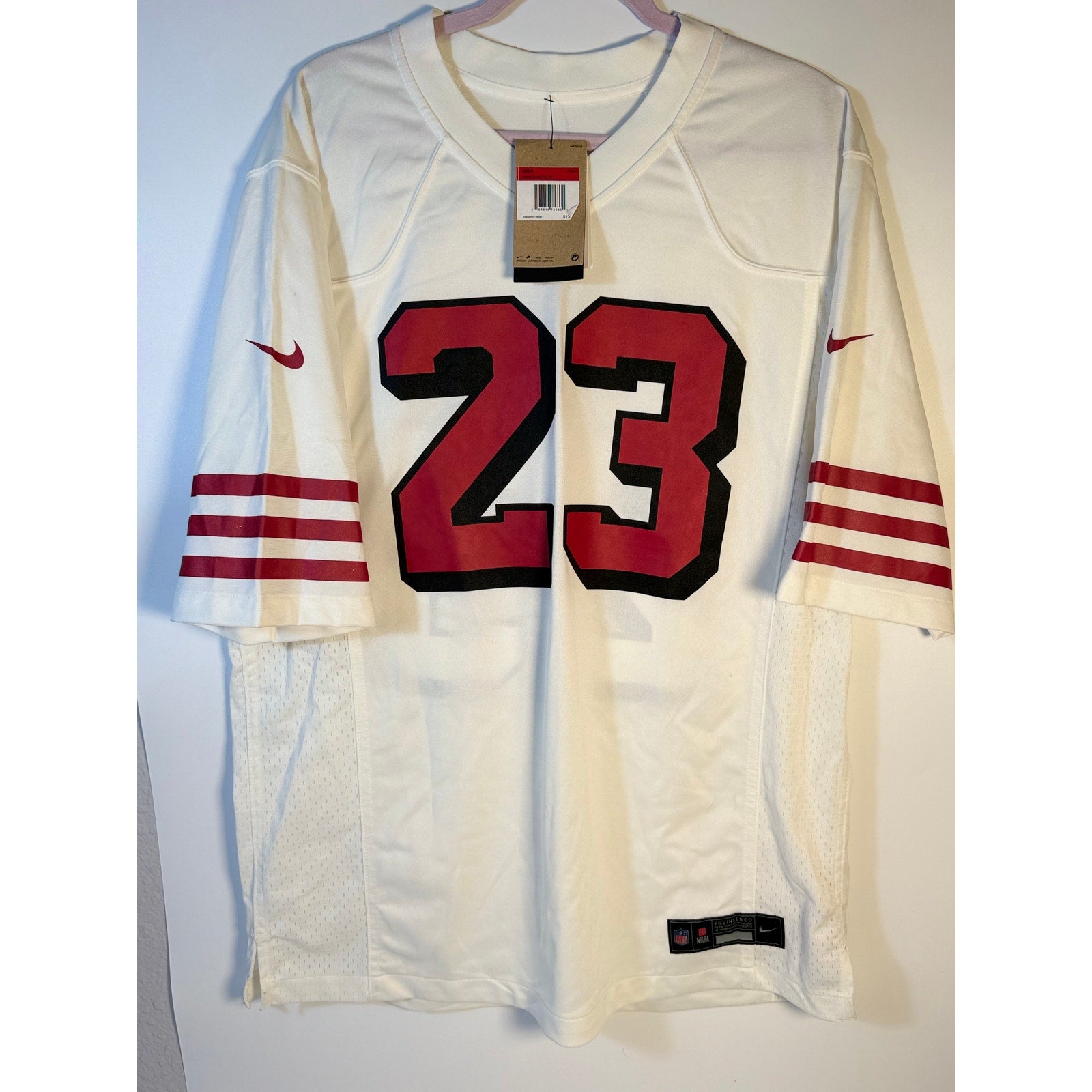 Nike Christian McCaffrey #23 San Francisco 49ers white NFL jersey for men, size large, new with tags, displayed flat.