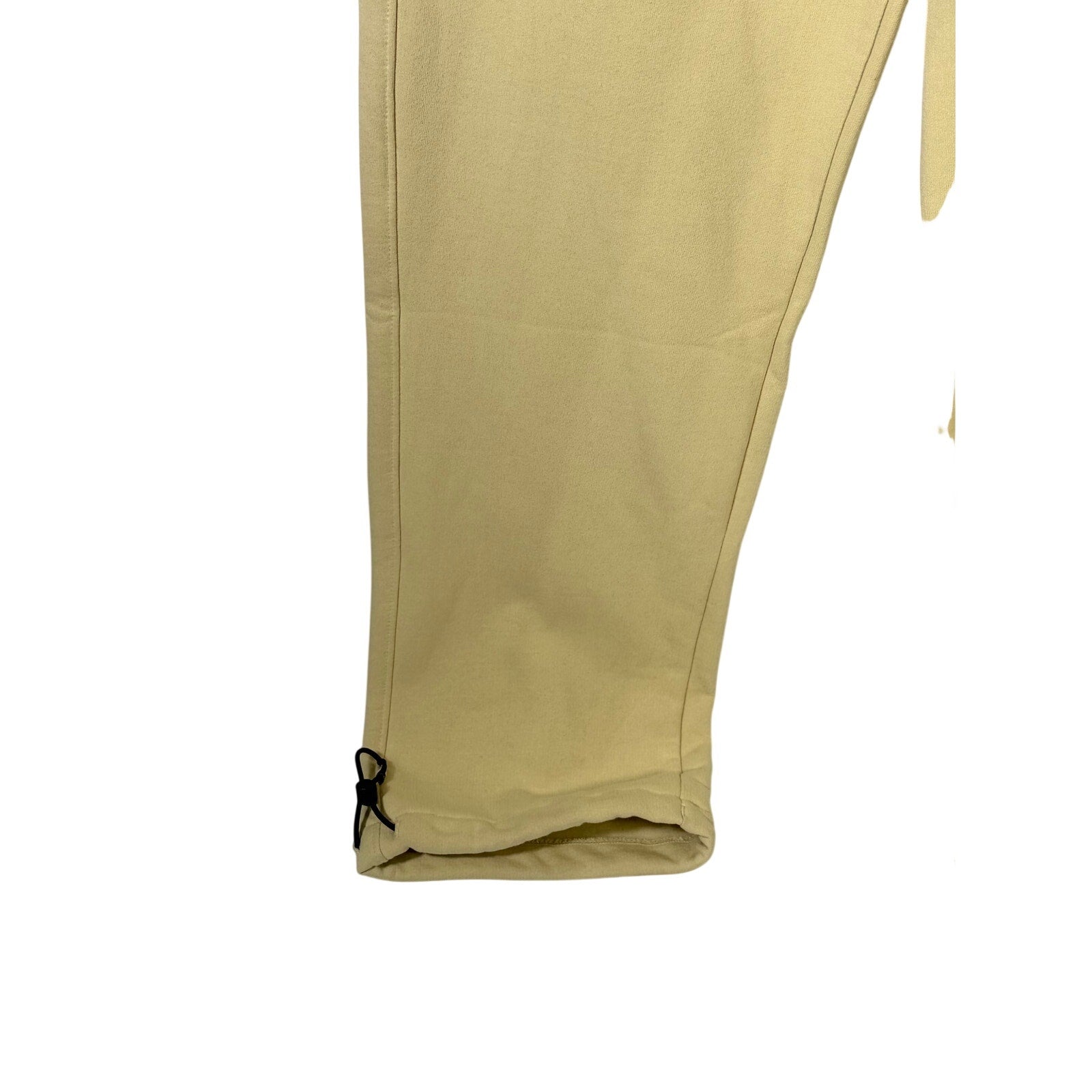 The North Face men's AXYS sweatpants in gravel beige, size small, featuring a relaxed fit and logo details.