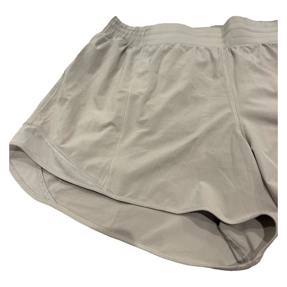 Lululemon Hotty Hot high-rise lined shorts in tan beige for women, size 14, showing the 4-inch inseam and comfortable fit.