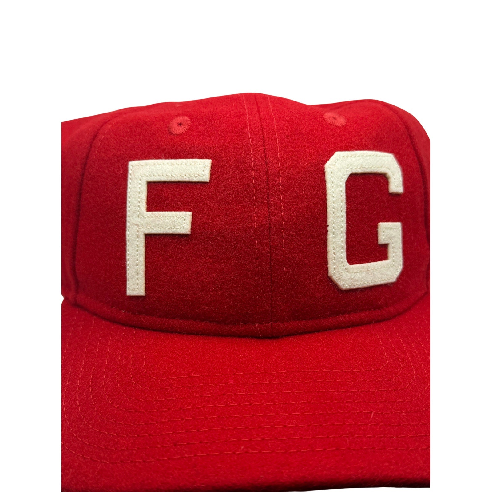 Red and cream Fear of God x New Era 59FIFTY fitted hat with FG logo, one size, showcasing the stylish cap design.