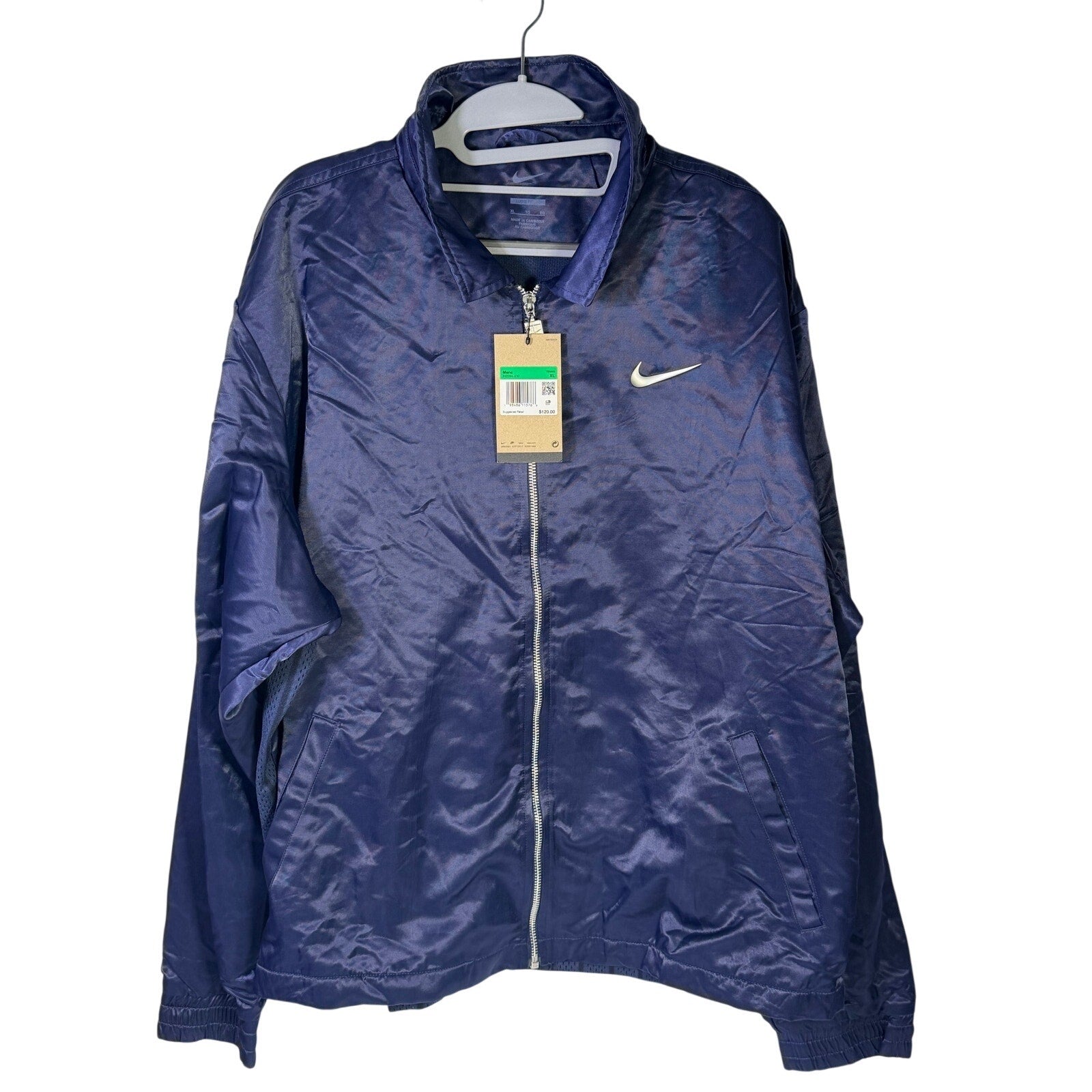 Nike men's navy blue full-zip running jacket, lightweight size XL, shown on a hanger with front view.