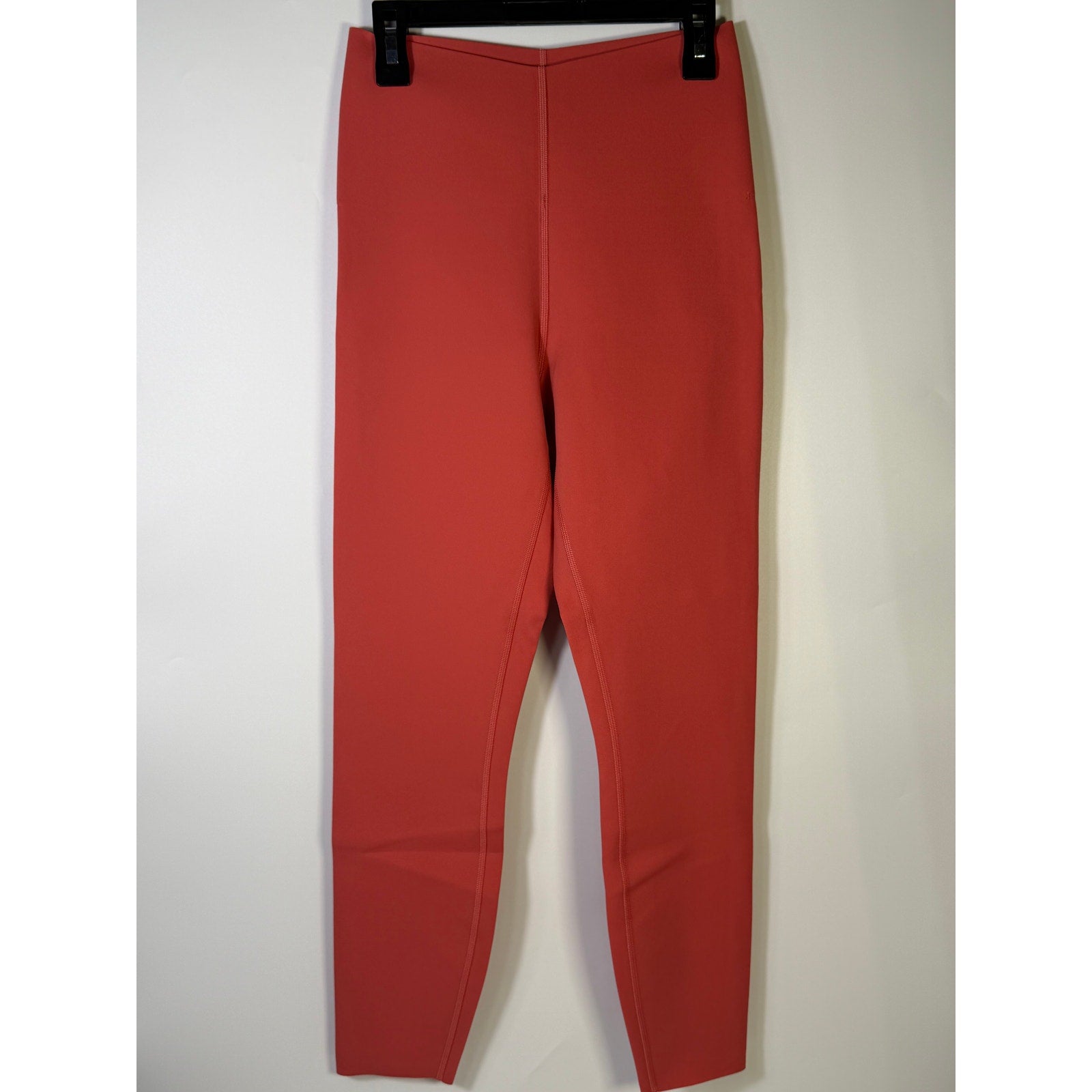 Lululemon Glow Up HR Tight 25-inch women's red leggings, fitted with high-rise waistband, shown on a model.