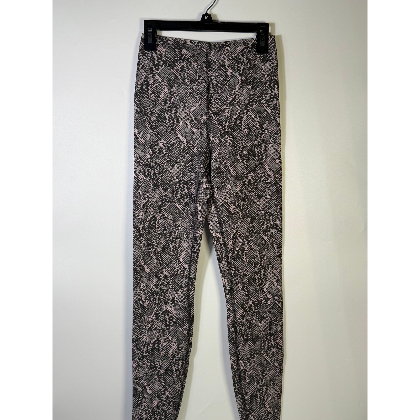 Lululemon Glow Up SHR Tight leggings in size 4, pink and black snakeskin pattern, featuring a high-rise fit and athletic style.