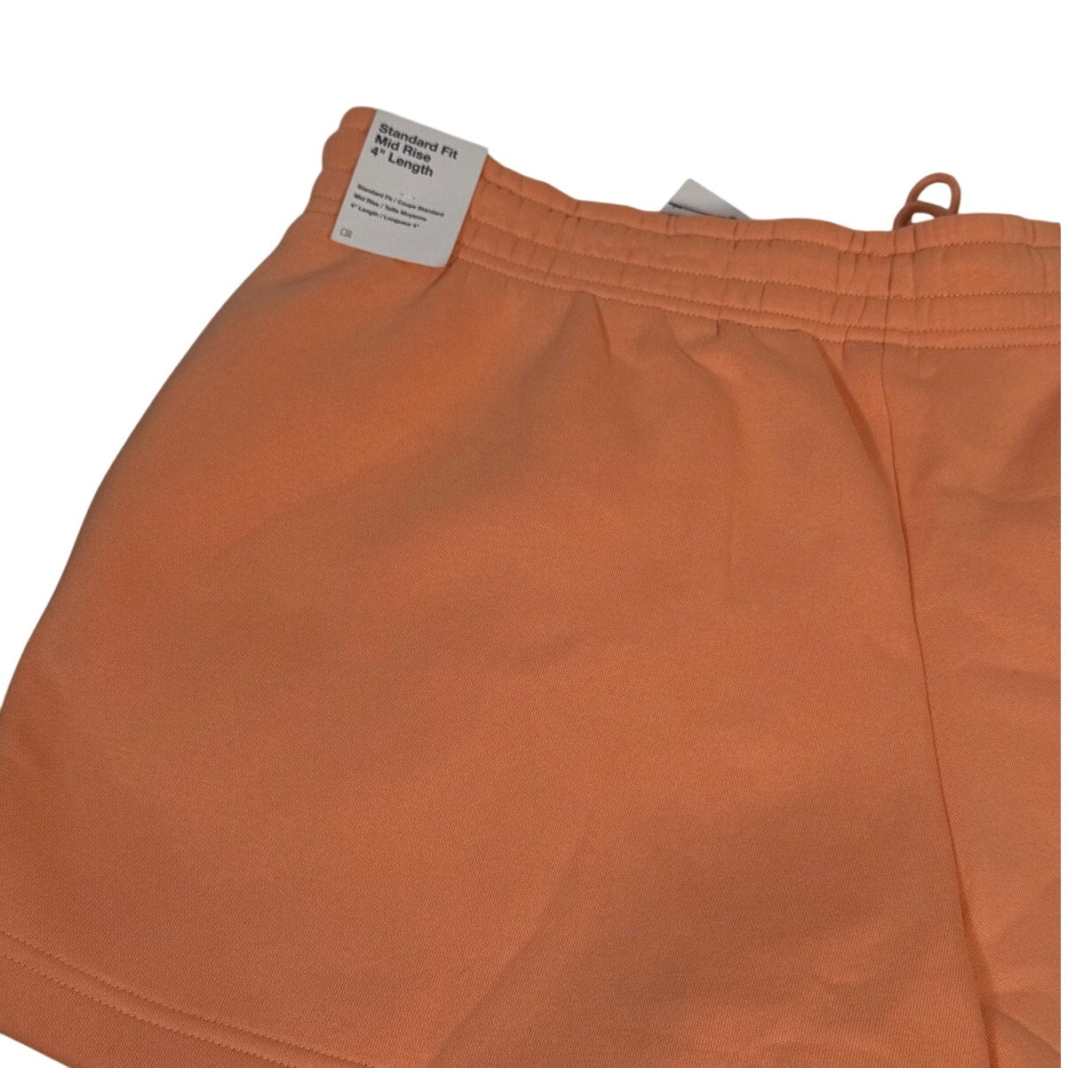 Nike women's peach orange fleece drawstring shorts, size XL, with a relaxed fit and comfortable waistband.