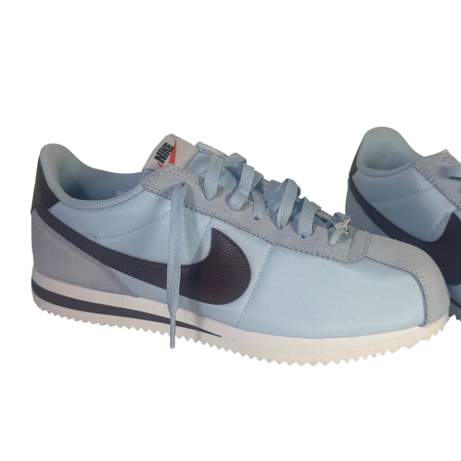 Nike Classic Cortez nylon men's sneakers in light blue and burgundy, size 8.5, featuring a sleek design and iconic style.