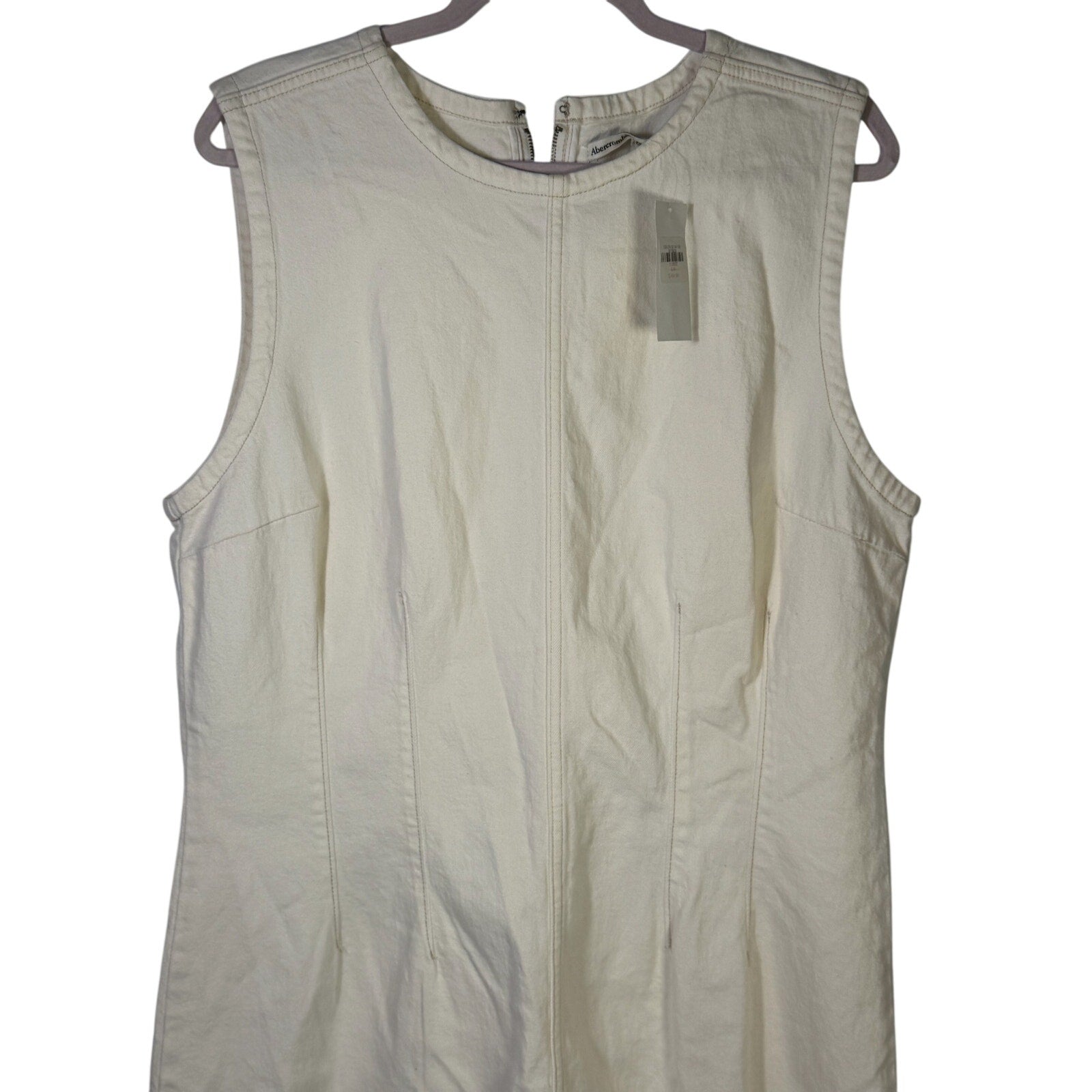 Abercrombie & Fitch cream denim mini shift dress in size XL, lightweight casual dress with sleeveless design and front pockets.