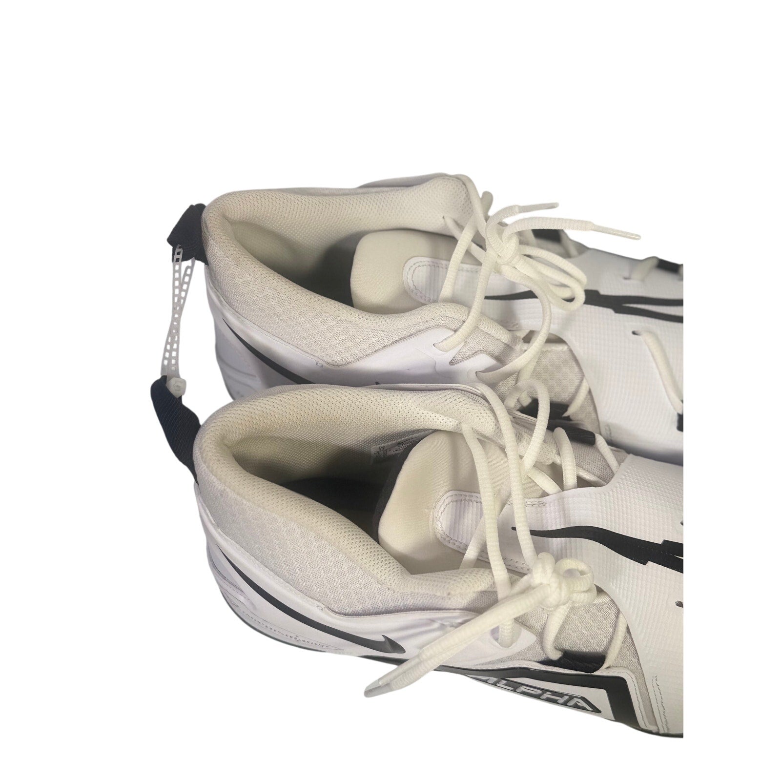 Nike Alpha men’s football cleats in white and black with size 17, featuring a sleek athletic design and studded sole for grip.