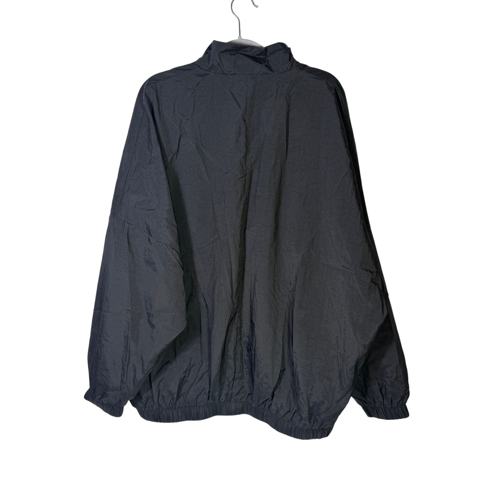 Nike women's black WNBA windbreaker jacket, size M, full zip, mesh-lined, lightweight jacket with sporty design.