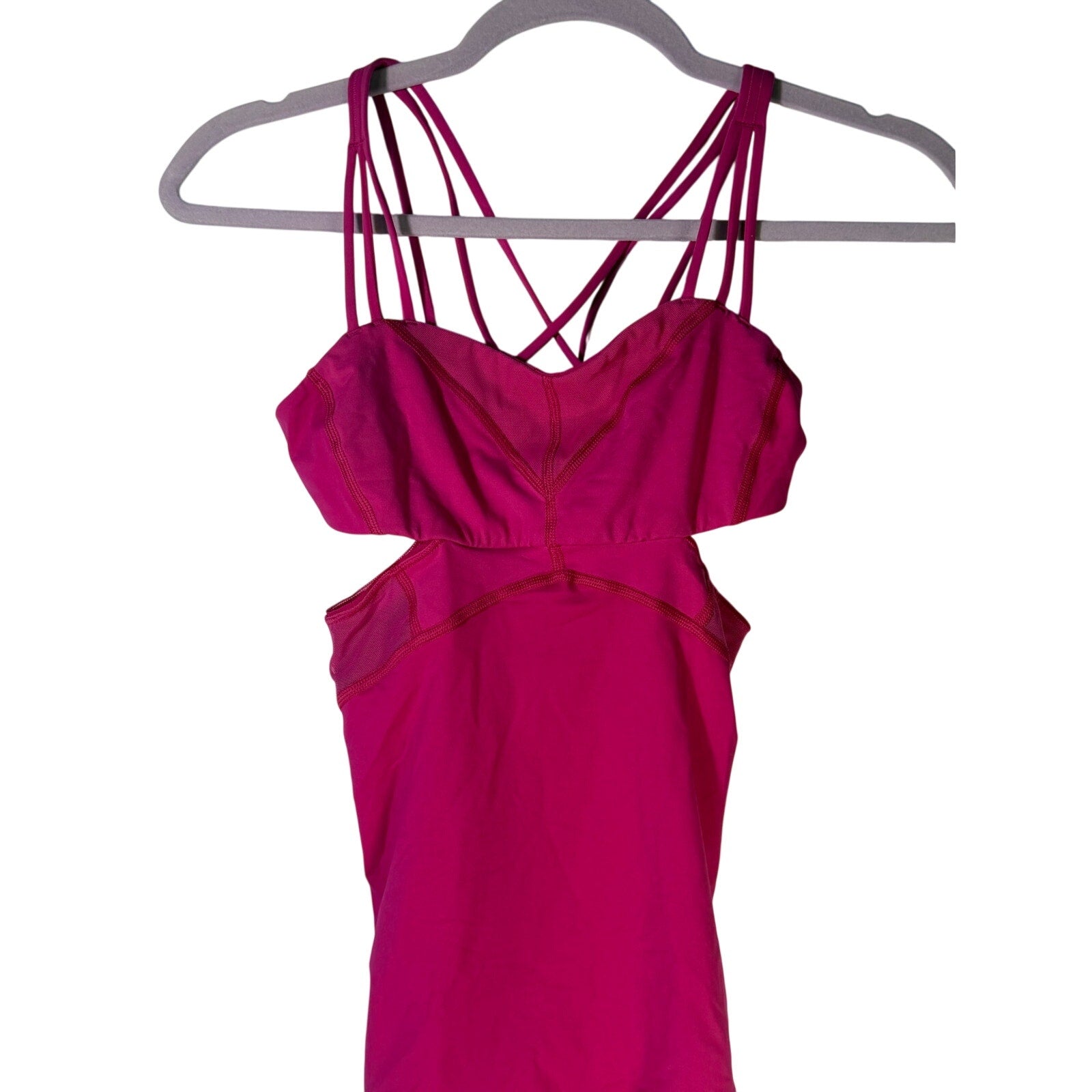 Lululemon women's magenta strappy cutout athletic tank top, size 2, pre-owned, shown on a hanger with a close-up of cutout design.