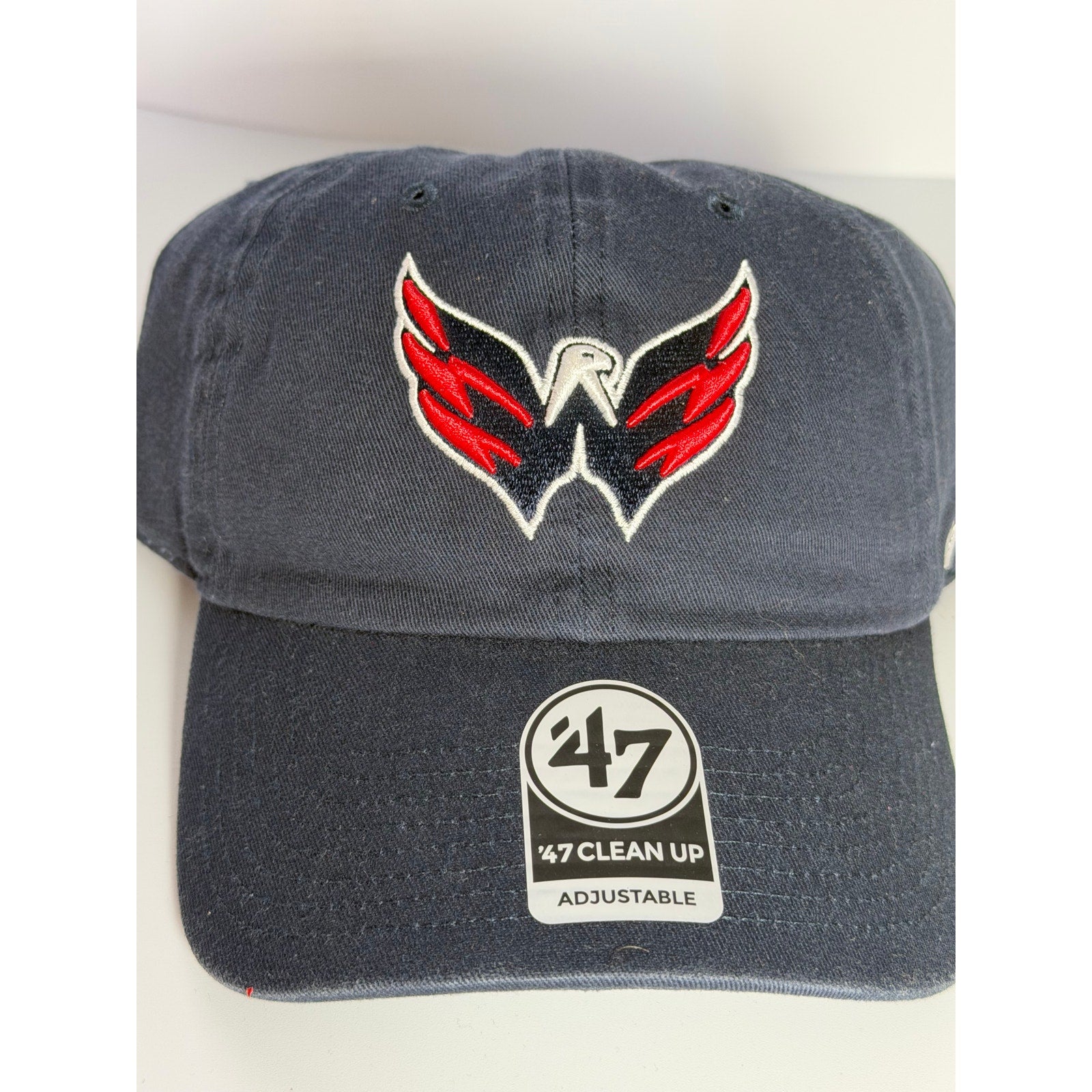Navy 47 Brand Washington Capitals adjustable strapback hat with embroidered team logo, NHL official merchandise.