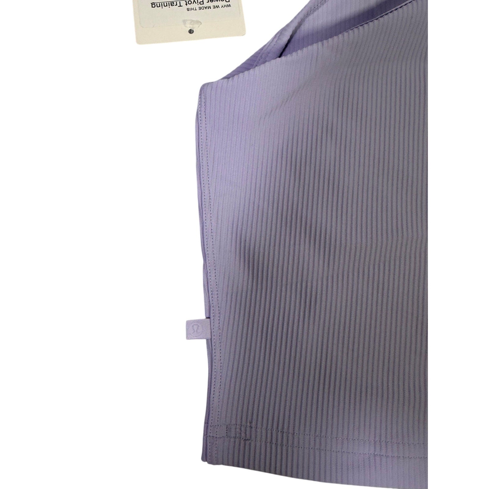 Lululemon Power Pivot Training Tank Top in lavender frost color, size XL, displayed flat with fabric details visible.