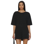 FP Movement Hot Shot Tee Romper in black, women's medium, one-piece with shorts, casual and comfortable activewear.