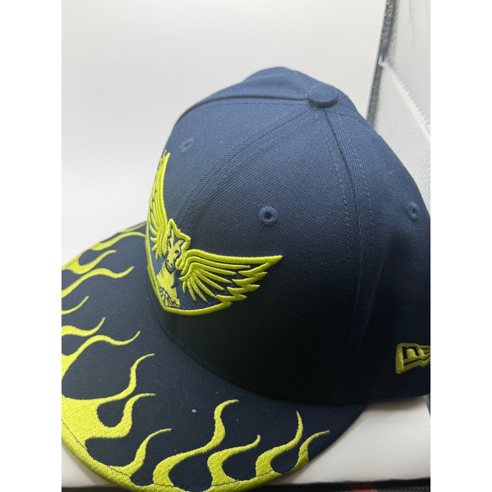 Dallas Wings WNBA New Era snapback hat in navy with neon yellow flame brim, one size adjustable, stylish sports cap