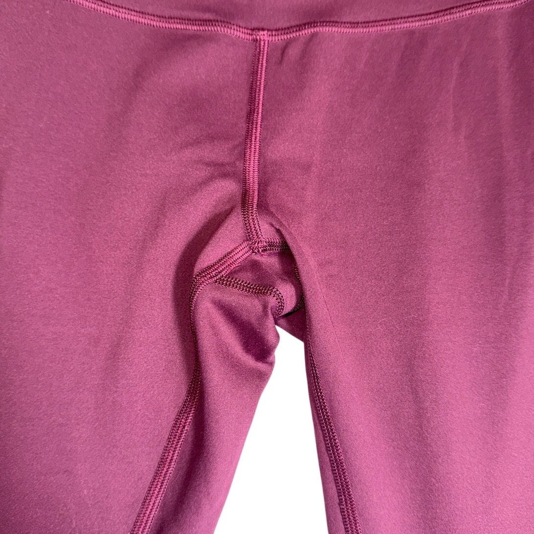 Lululemon women's burgundy high-rise flared yoga leggings size 6, shown laid flat with waistband and flared legs.