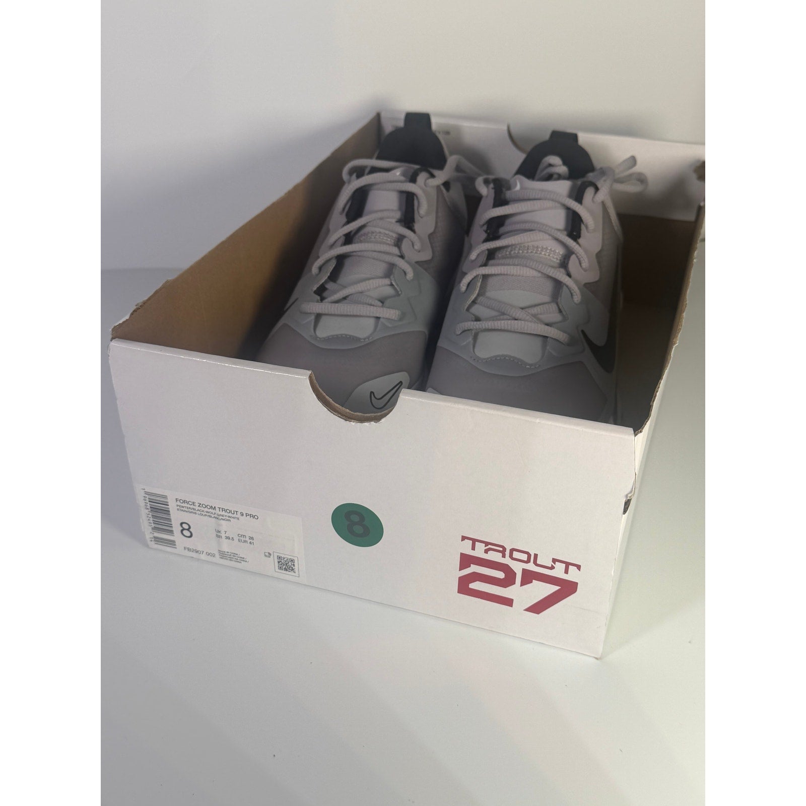 Nike Force Zoom Trout 9 Pro men's baseball cleats in grey, athletic shoes with Nike branding and cleat spikes visible.