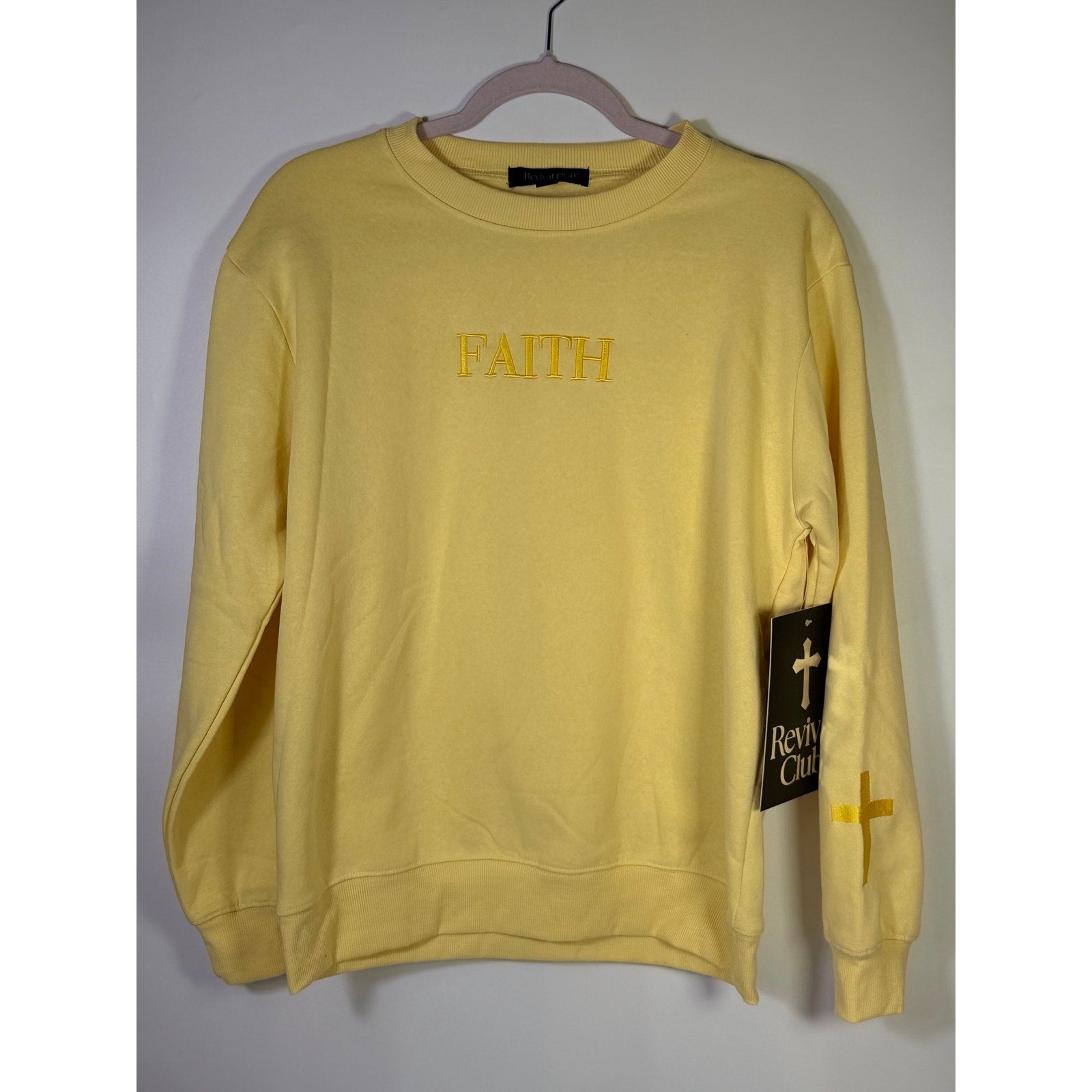 Yellow Revival Club Faith Cross crewneck sweatshirt with Christian design, size Small, soft cotton fabric, front view.