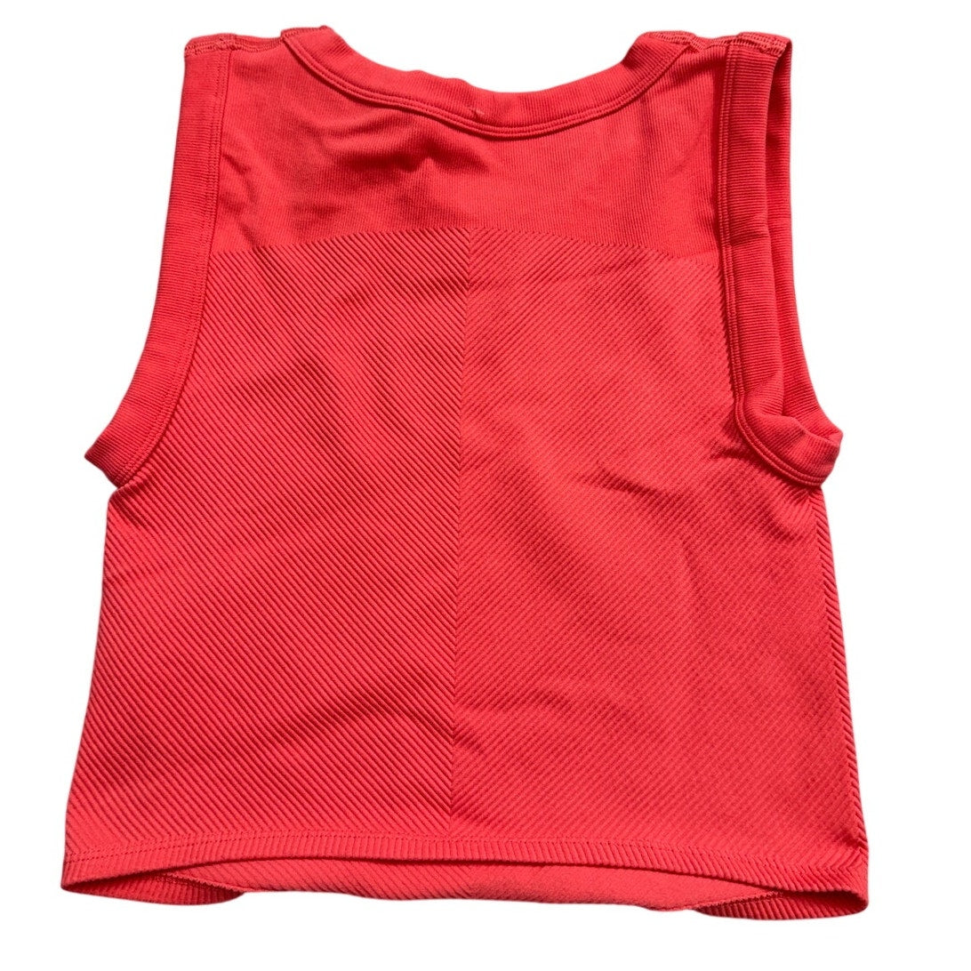 FP Movement coral pink ribbed cropped tank top, XS/S size, performance athletic wear, shown on a neutral background.