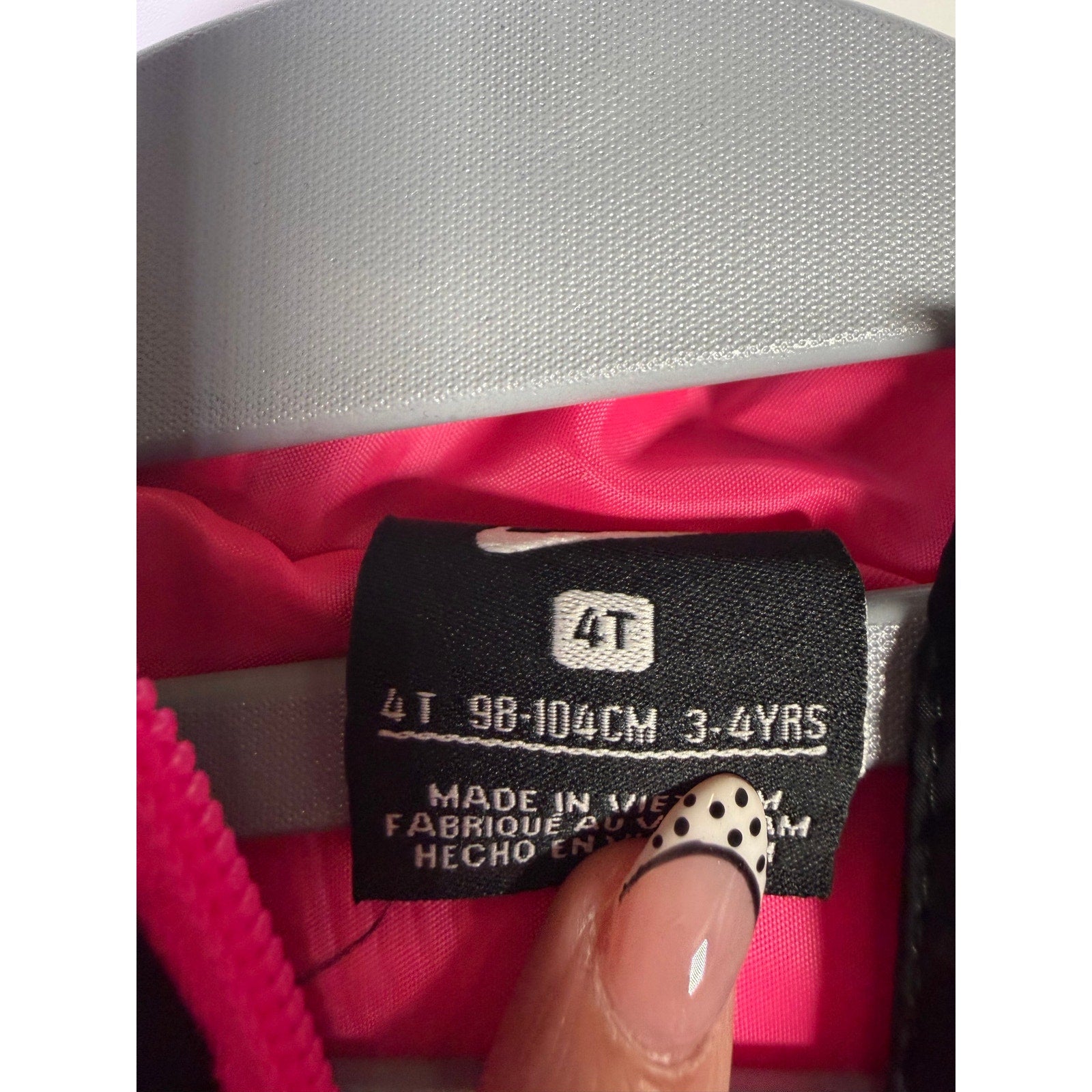 Nike toddler girls’ black and pink hooded puffer jacket, size 4T, insulated and cozy for cold weather.