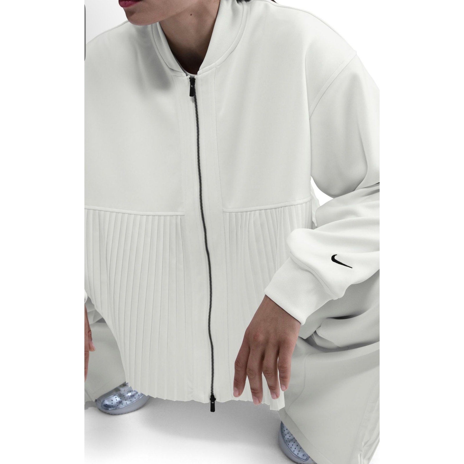 Nike women's pleated bomber jacket in sail white, full zip, size M, featuring a stylish design and modern silhouette.