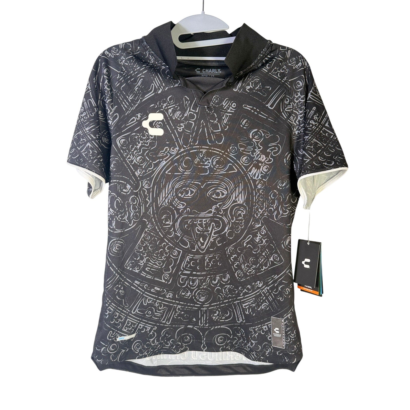 Men's black Charly Mexico Heritage SS soccer jersey with aztec print, size XS, featuring short sleeves and athletic fit.